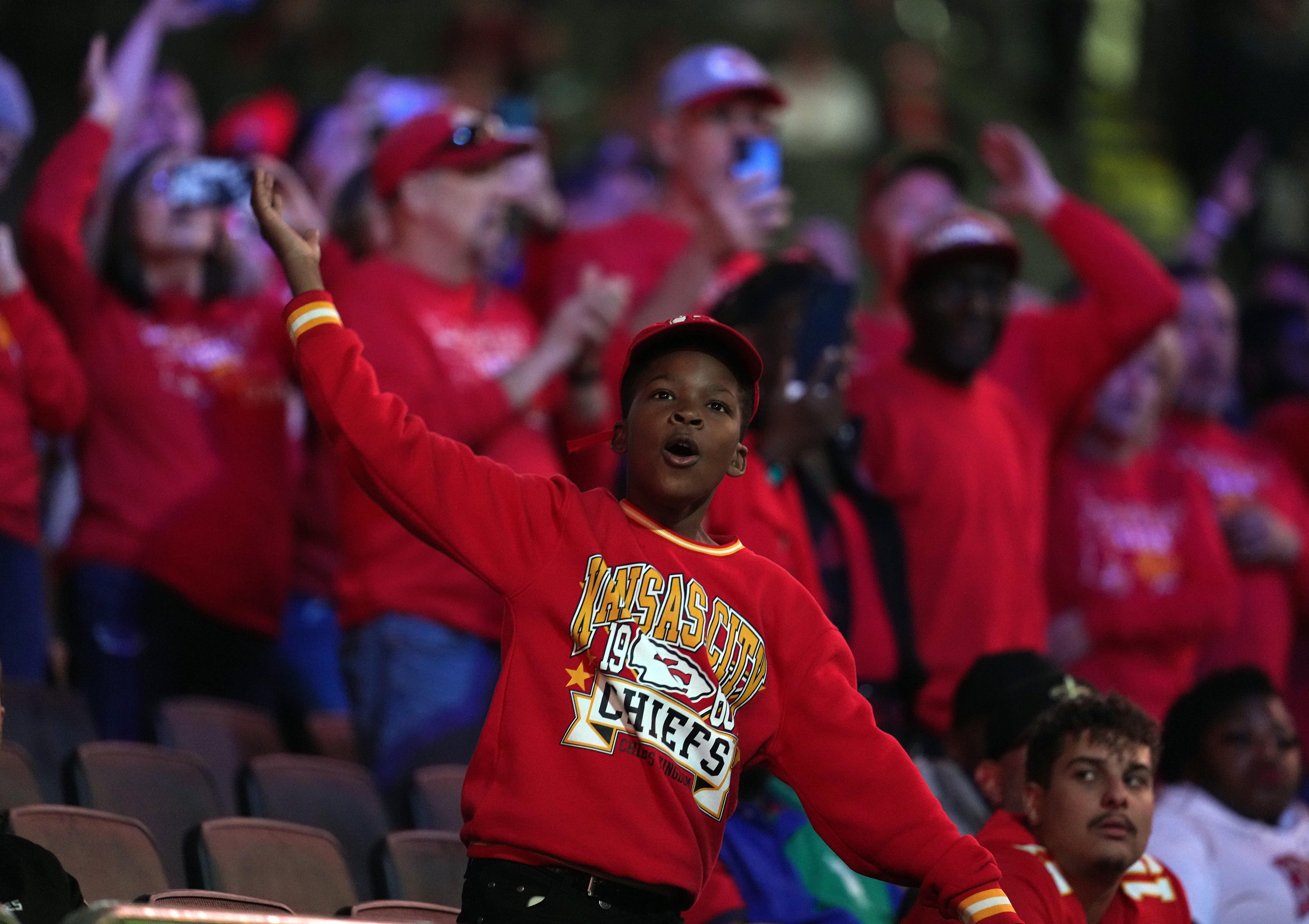 Feb 3, 2025; New Orleans, LA, USA; A Kansas City Chiefs fan cheers during Super Bowl LIX Opening Night at Ceasars Superdome.