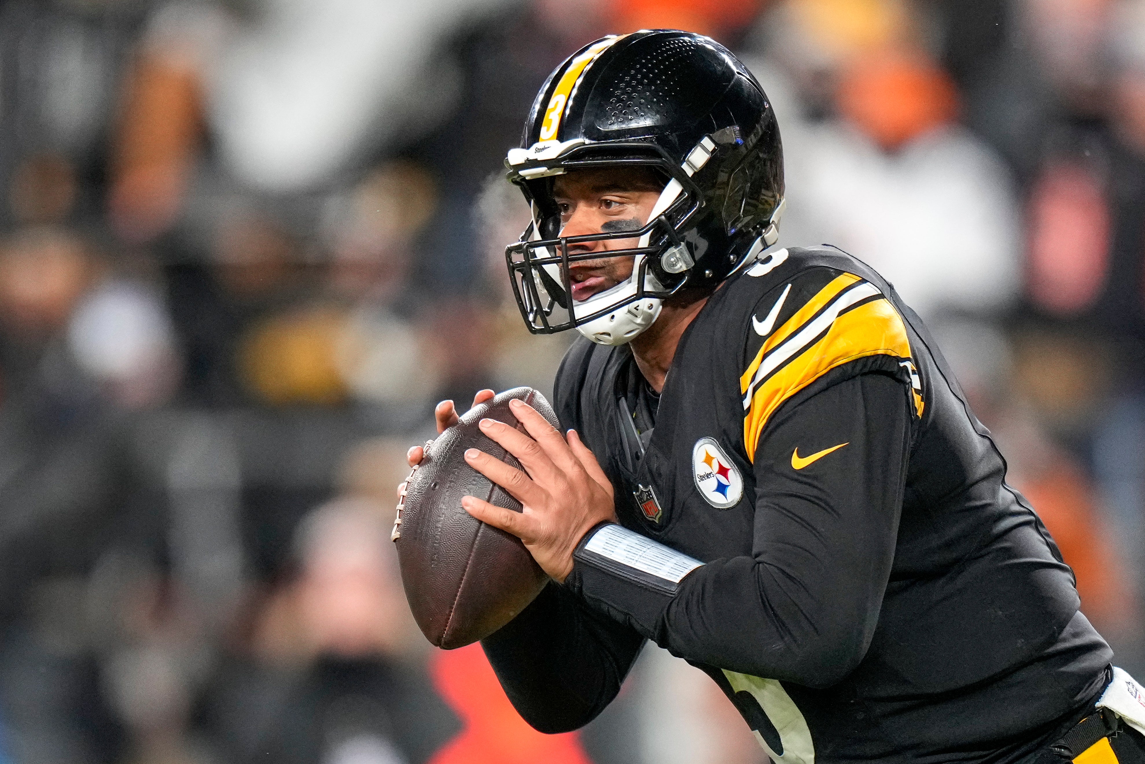 Jan 4, 2025; Pittsburgh, Pennsylvania, USA; Pittsburgh Steelers quarterback Russell Wilson (3) scrambles out of the pocket against the Cincinnati Bengals in the fourth quarter at Acrisure Stadium. The Bengals won 19-17 to finish the regular season at 9-8.