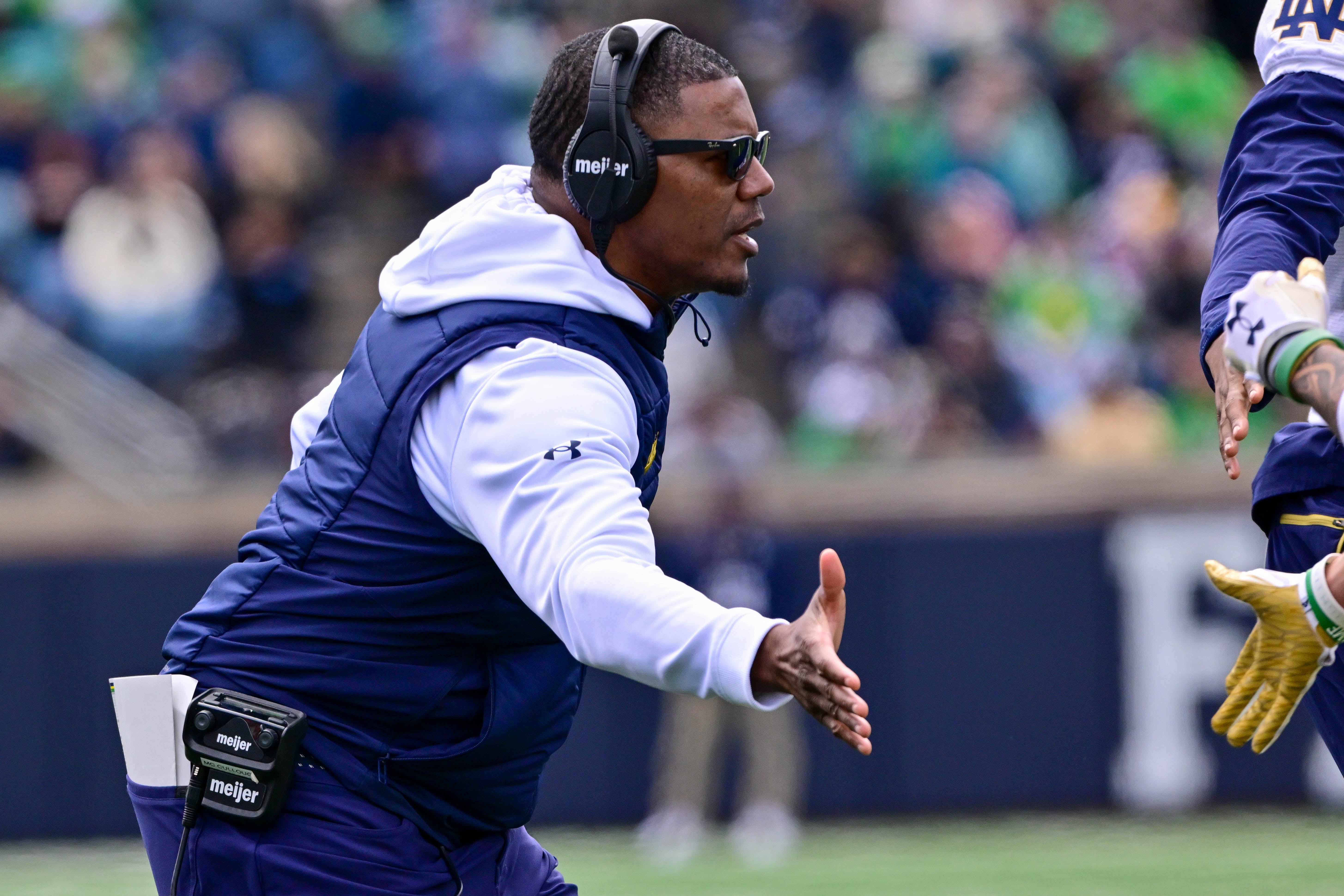 Notre Dame Fighting Irish Gold team coach Deland McCullough celebrates after a touchdown in the Blue-Gold Game at Notre Dame Stadium.