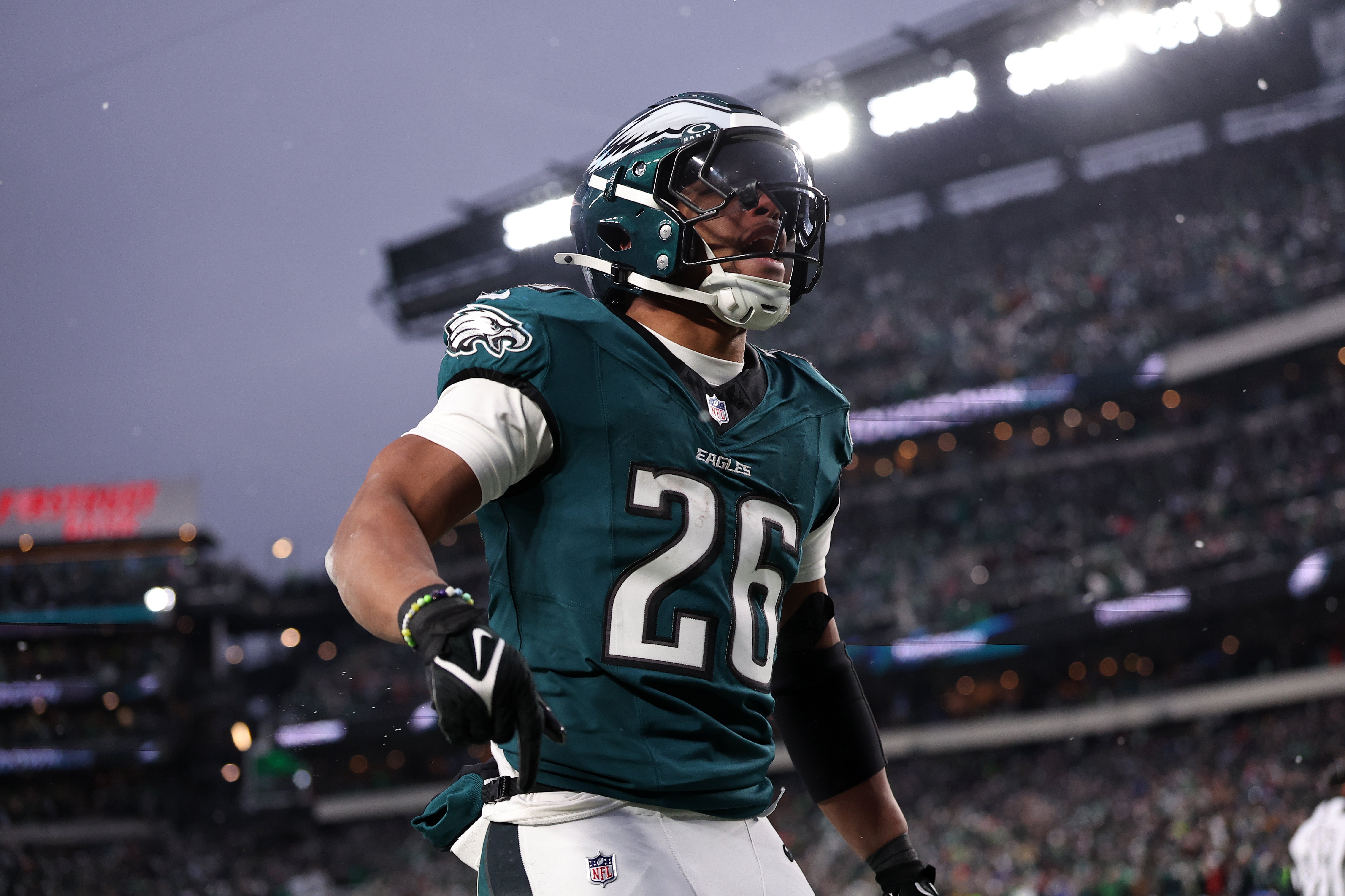 Philadelphia Eagles running back Saquon Barkley (26) celebrates after scoring a touchdown against the Los Angeles Rams in the first half in a 2025 NFC divisional round game at Lincoln Financial Field.