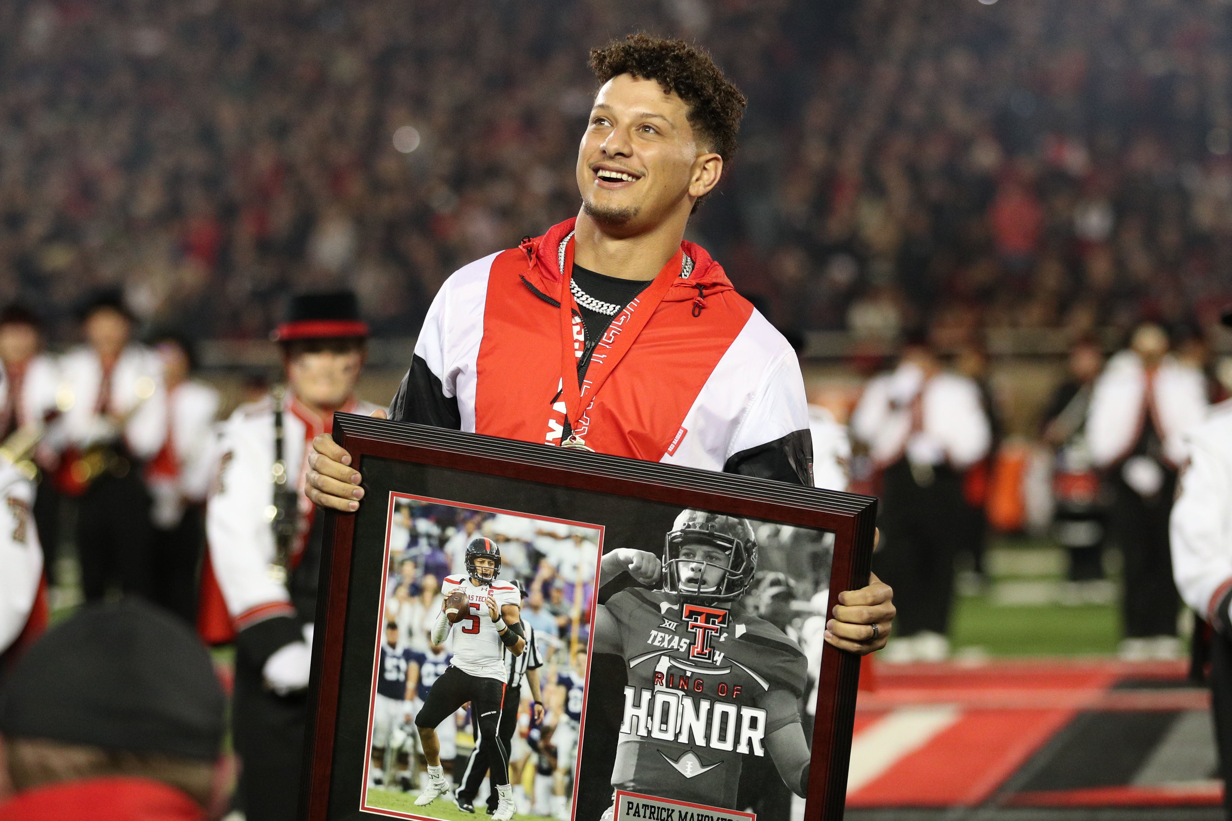 Oct 29, 2022; Lubbock, Texas, USA; Kansas City Chiefs quarterback Patrick Mahomes II watches as his name is unveiled during his induction in the Ring of Honor at half-time of a game between the Texas Tech Red Raiders and the Baylor Bears at Jones AT&T Stadium and Cody Campbell Field.