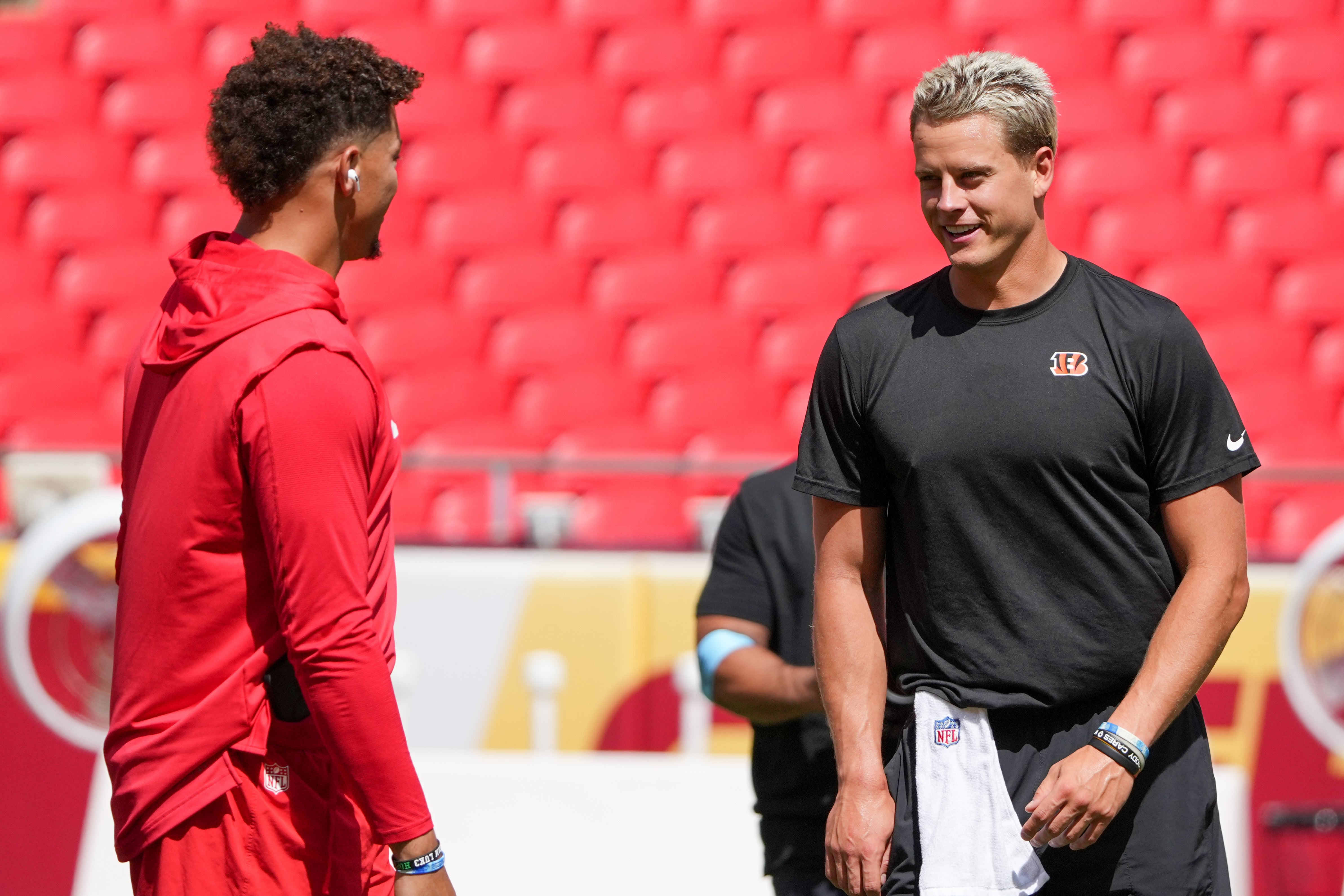 Sep 15, 2024; Kansas City, Missouri, USA; Kansas City Chiefs quarterback Patrick Mahomes (15) talks with Cincinnati Bengals quarterback Joe Burrow (9) on field prior to a game at GEHA Field at Arrowhead Stadium.