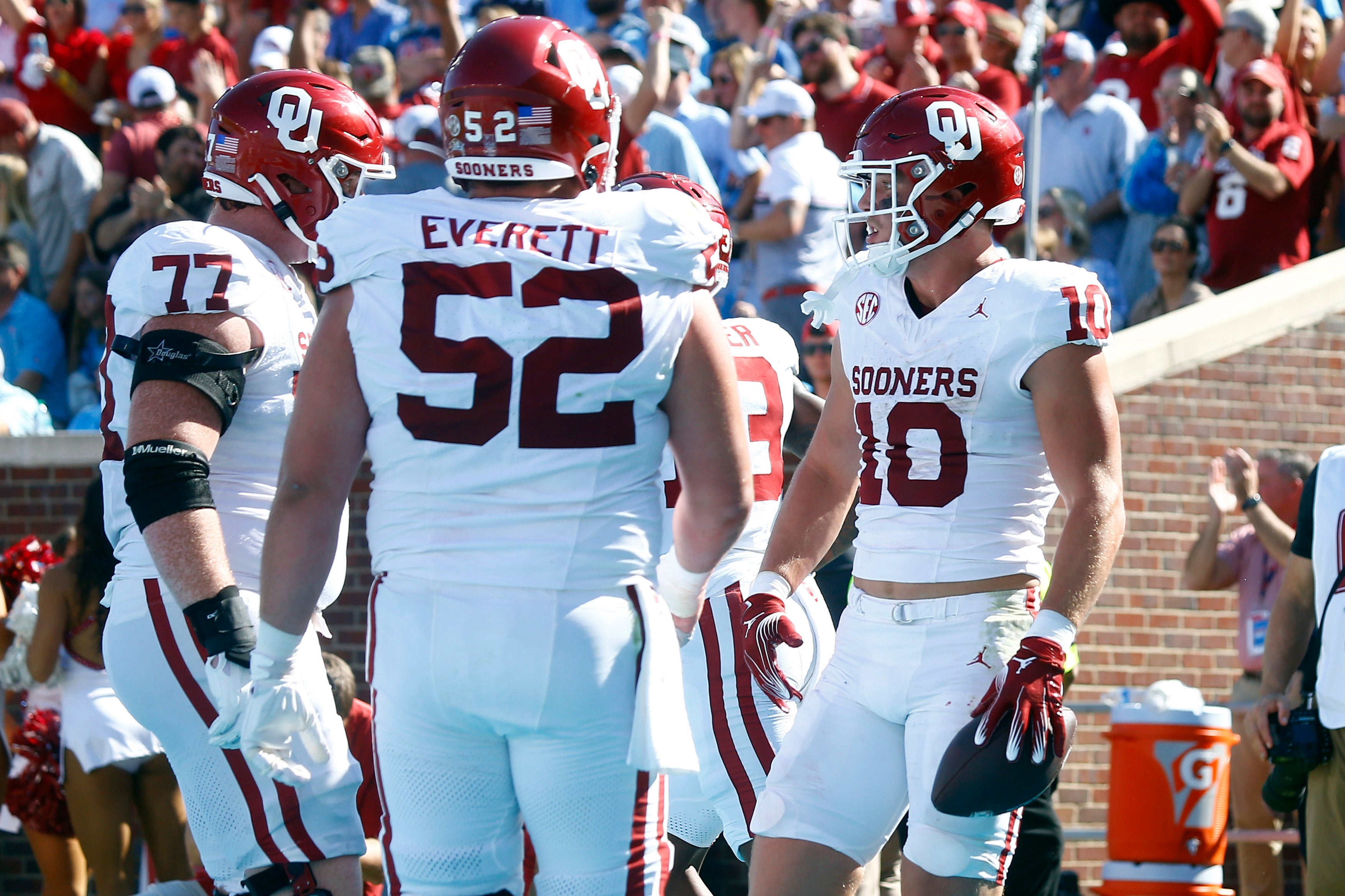 Oct 26, 2024; Oxford, Mississippi, USA; Oklahoma Sooners tight end Bauer Sharp (10) reacts with offensive linemen Heath Ozaeta (77) and Troy Everett (52) after a touchdown during the first half against the Mississippi Rebels at Vaught-Hemingway Stadium.