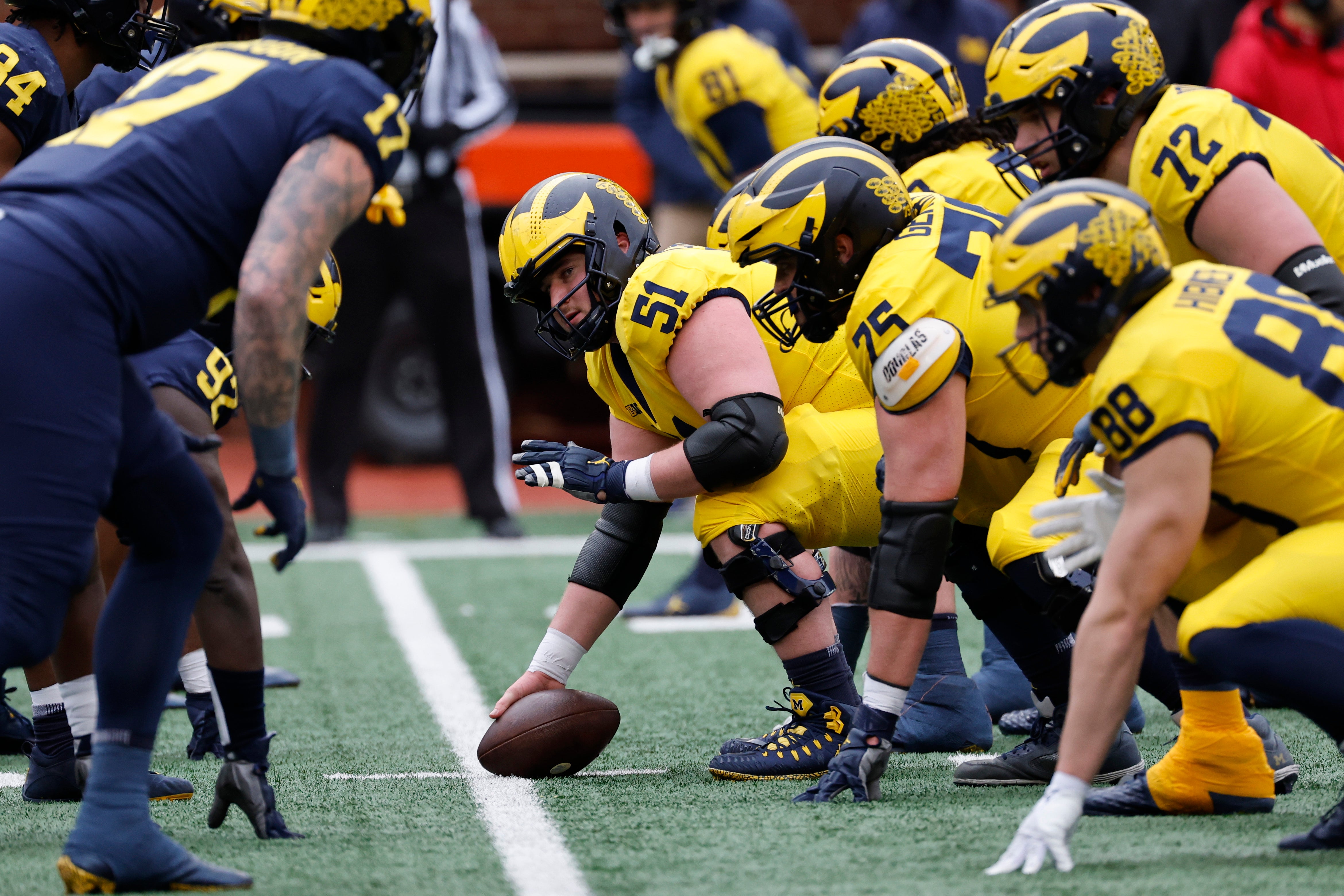 Apr 1, 2023; Ann Arbor, MI, USA; Michigan Wolverines offensive lineman Greg Crippen (51) prepares to snap during the Spring Game at Michigan Stadium.