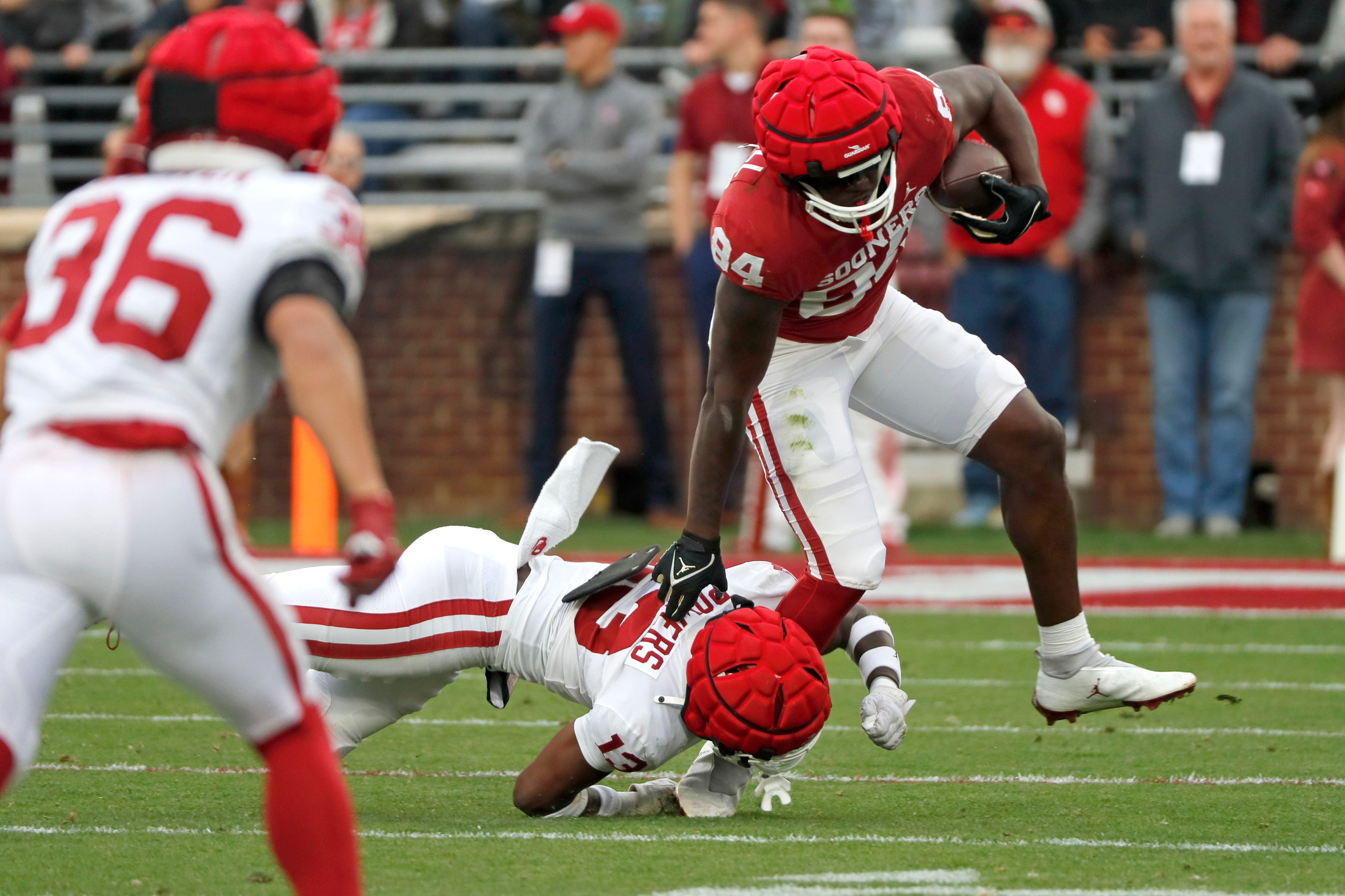 Oklahoma's Davon Mitchell is brought down by Reggie Powers III during a University of Oklahoma (OU) Sooners spring football game at Gaylord Family-Oklahoma Memorial Stadium in Norman, Okla., Saturday, April 20, 2024.