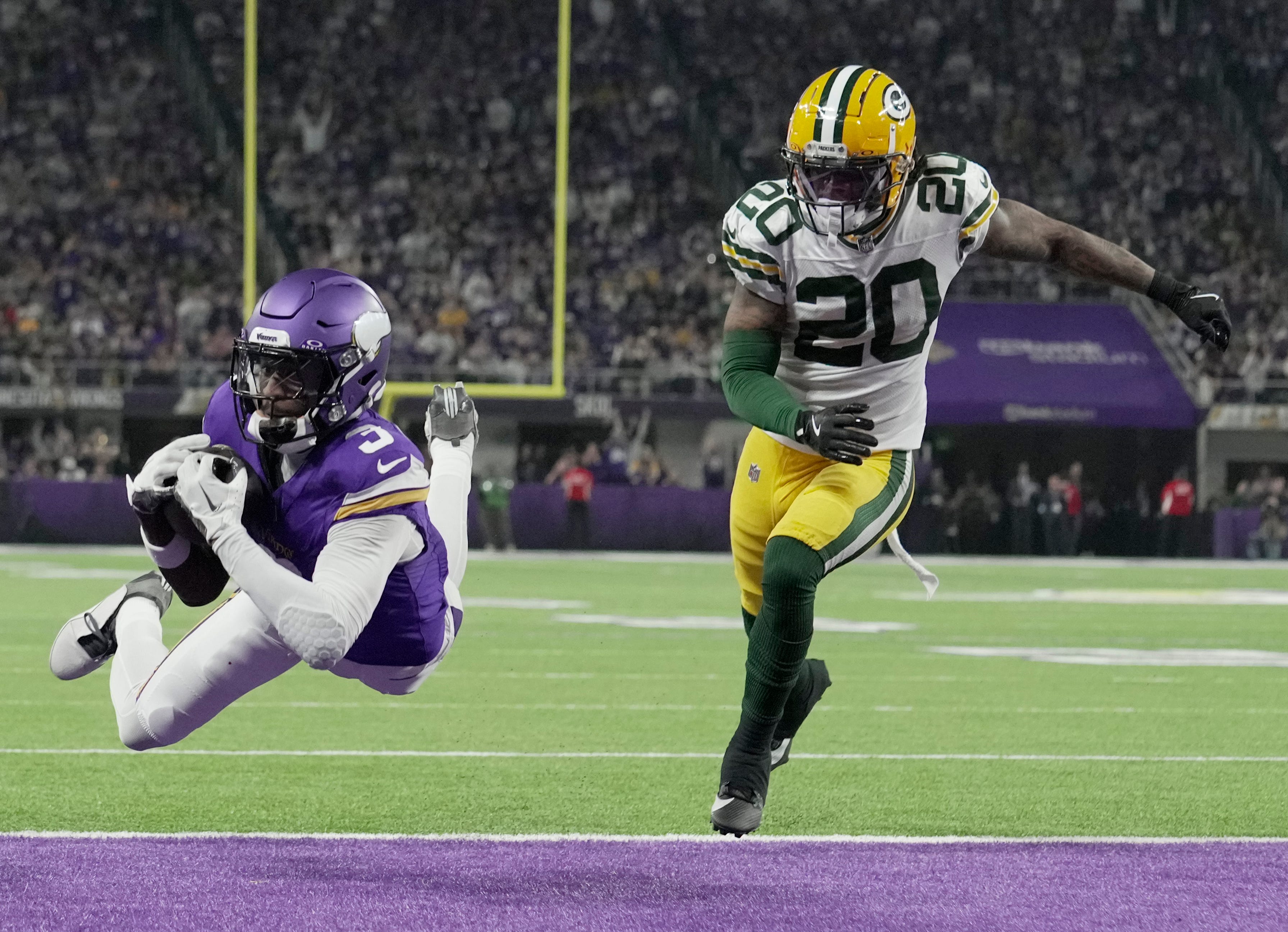 Minnesota Vikings wide receiver Jordan Addison (3) makes a 20-yard touchdown reception while being covered by Green Bay Packers safety Javon Bullard (20) during the third quarter of their game Sunday, December 29, 2024 at U.S. Bank Stadium in Minneapolis, Minnesota. The Minnesota Vikings beat the Green Bay Packers 27-25.