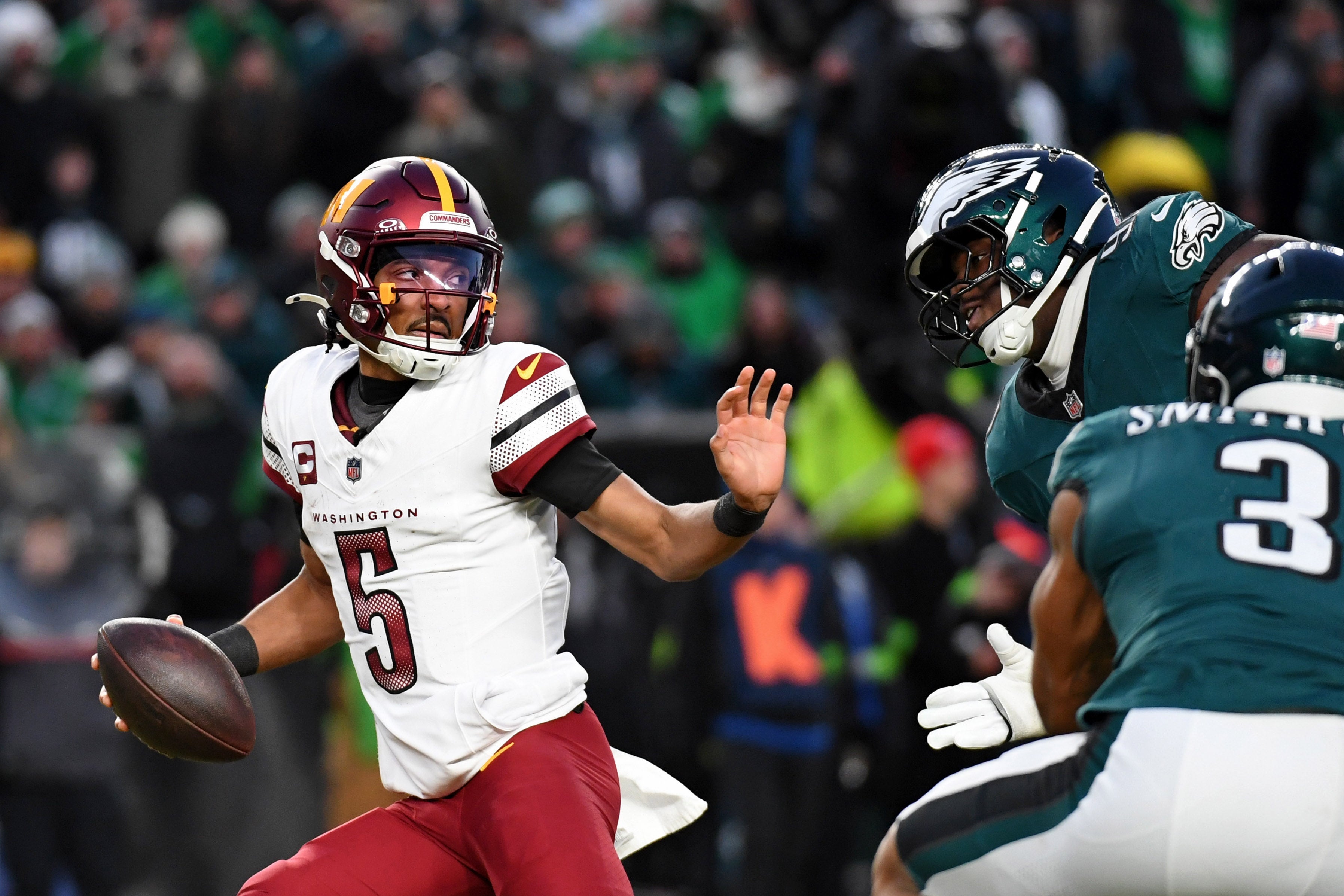 Jan 26, 2025; Philadelphia, PA, USA; Washington Commanders quarterback Jayden Daniels (5) looks to pass the ball against the Philadelphia Eagles during the second half in the NFC Championship game at Lincoln Financial Field.