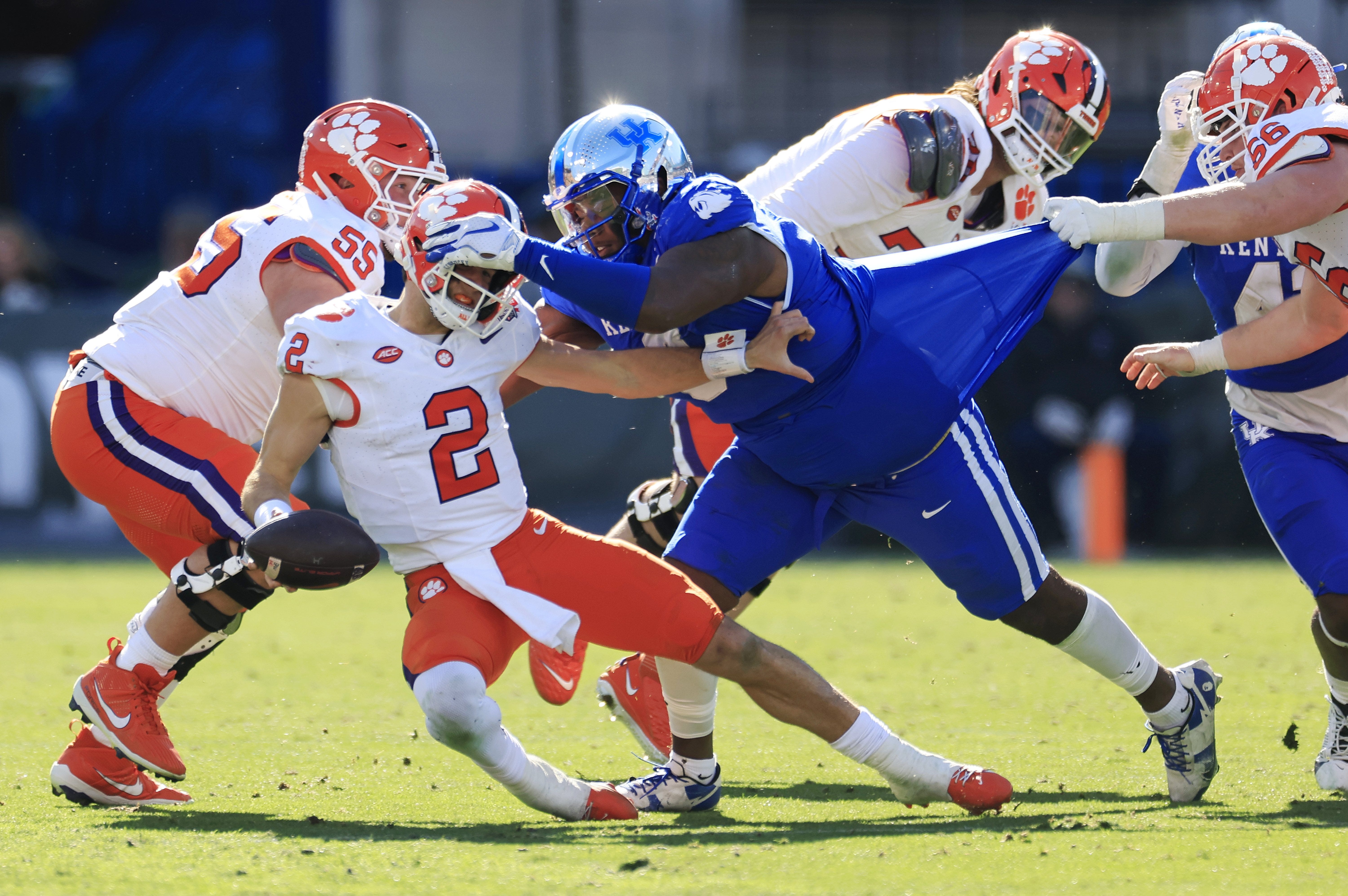 Clemson Tigers quarterback Cade Klubnik (2) is sacked by Kentucky Wildcats defensive lineman Deone Walker (0) during the third quarter of an NCAA football matchup in the TaxSlayer Gator Bowl Friday, Dec. 29, 2023 at EverBank Stadium in Jacksonville, Fla. The Clemson Tigers edged the Kentucky Wildcats 38-35.