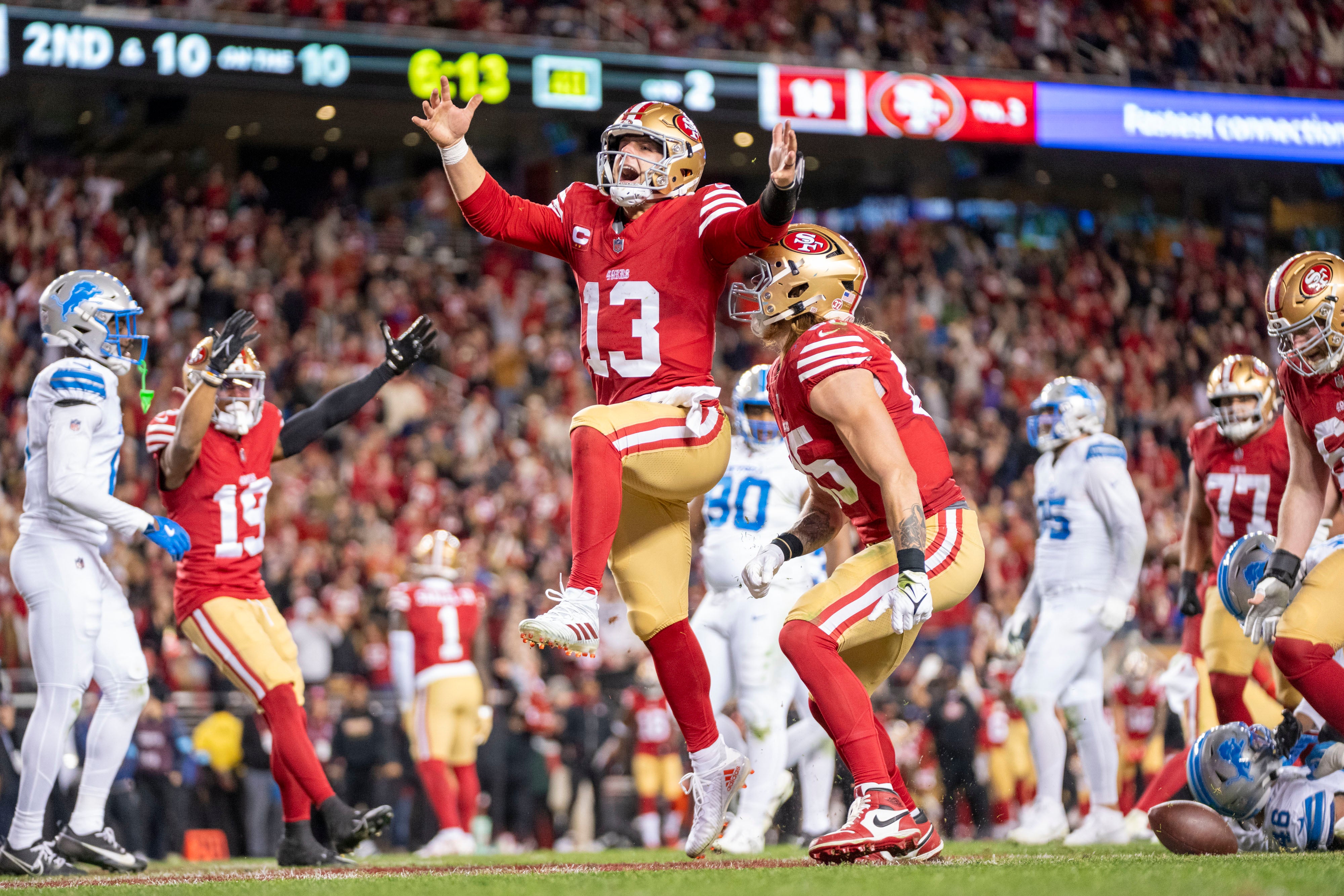 San Francisco 49ers quarterback Brock Purdy (13) celebrates with tight end George Kittle (85) after scoring a touchdown against the Detroit Lions during the second quarter at Levi's Stadium.