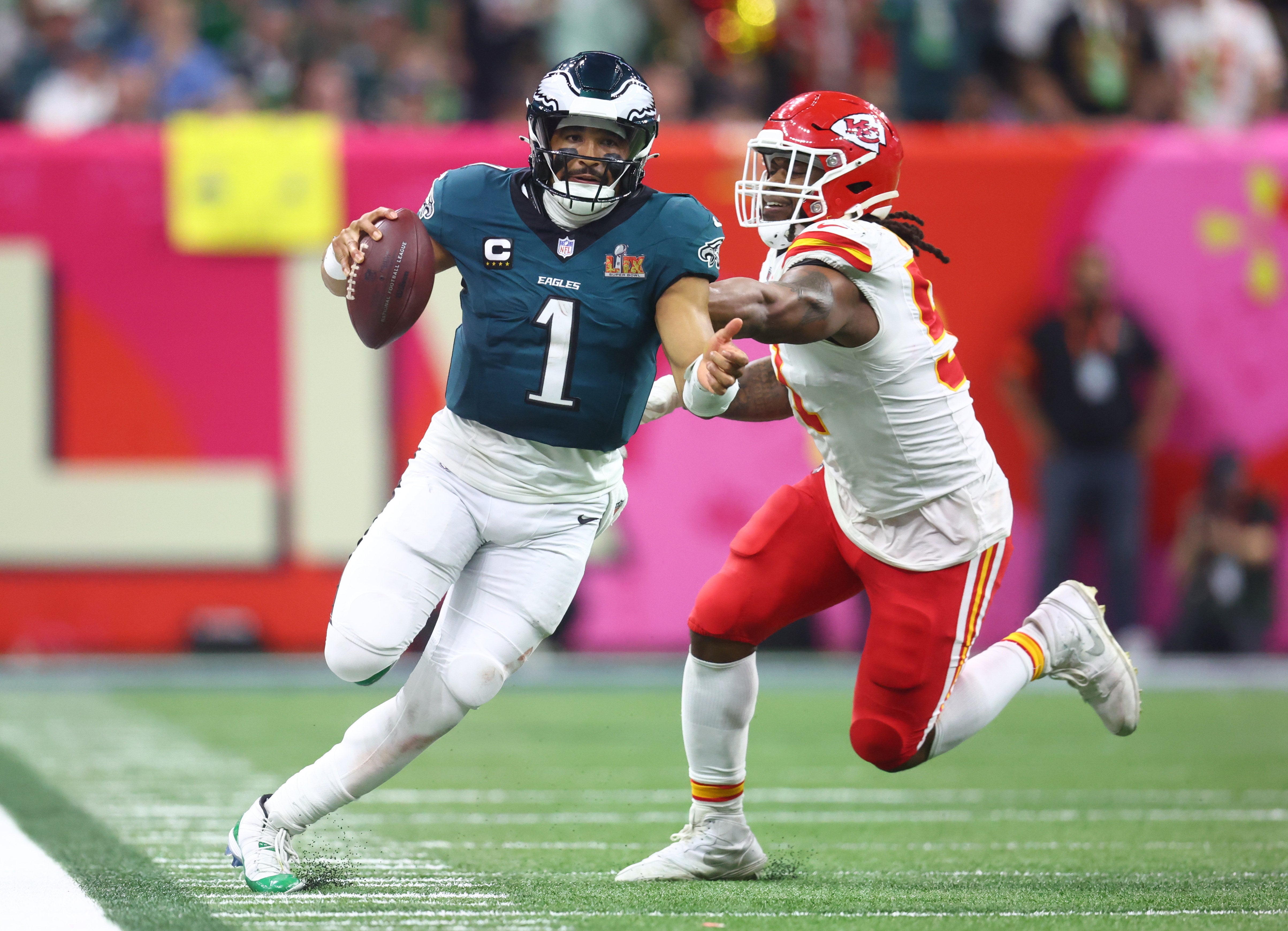 Philadelphia Eagles quarterback Jalen Hurts (1) runs the ball against the Kansas City Chiefs in the fourth quarter in Super Bowl LIX at Ceasars Superdome.