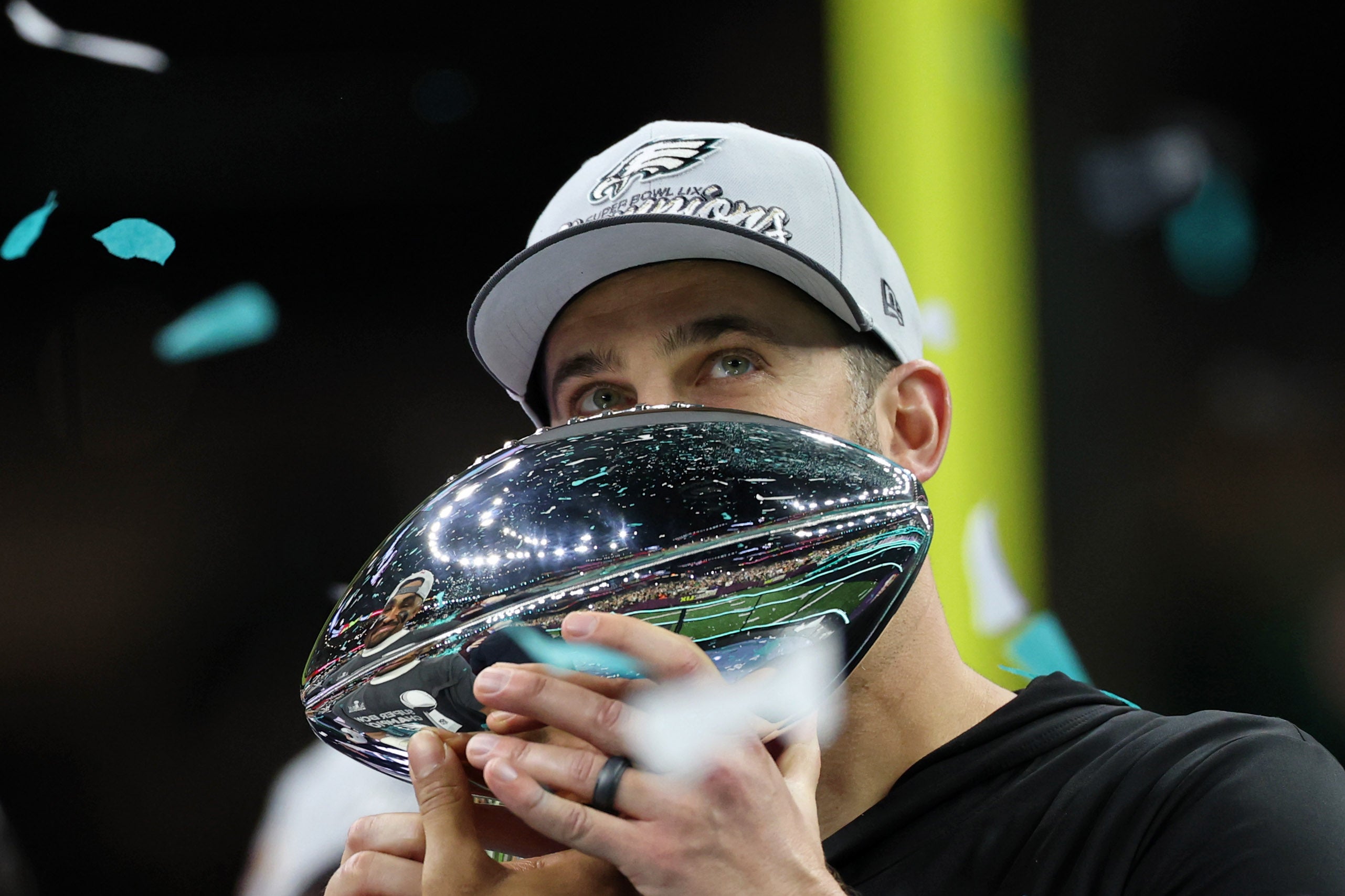 Feb 9, 2025; New Orleans, LA, USA; Philadelphia Eagles head coach Nick Sirianni kisses the Vince Lombardi Trophy after winning against Kansas City Chiefs in Super Bowl LIX at Caesars Superdome.