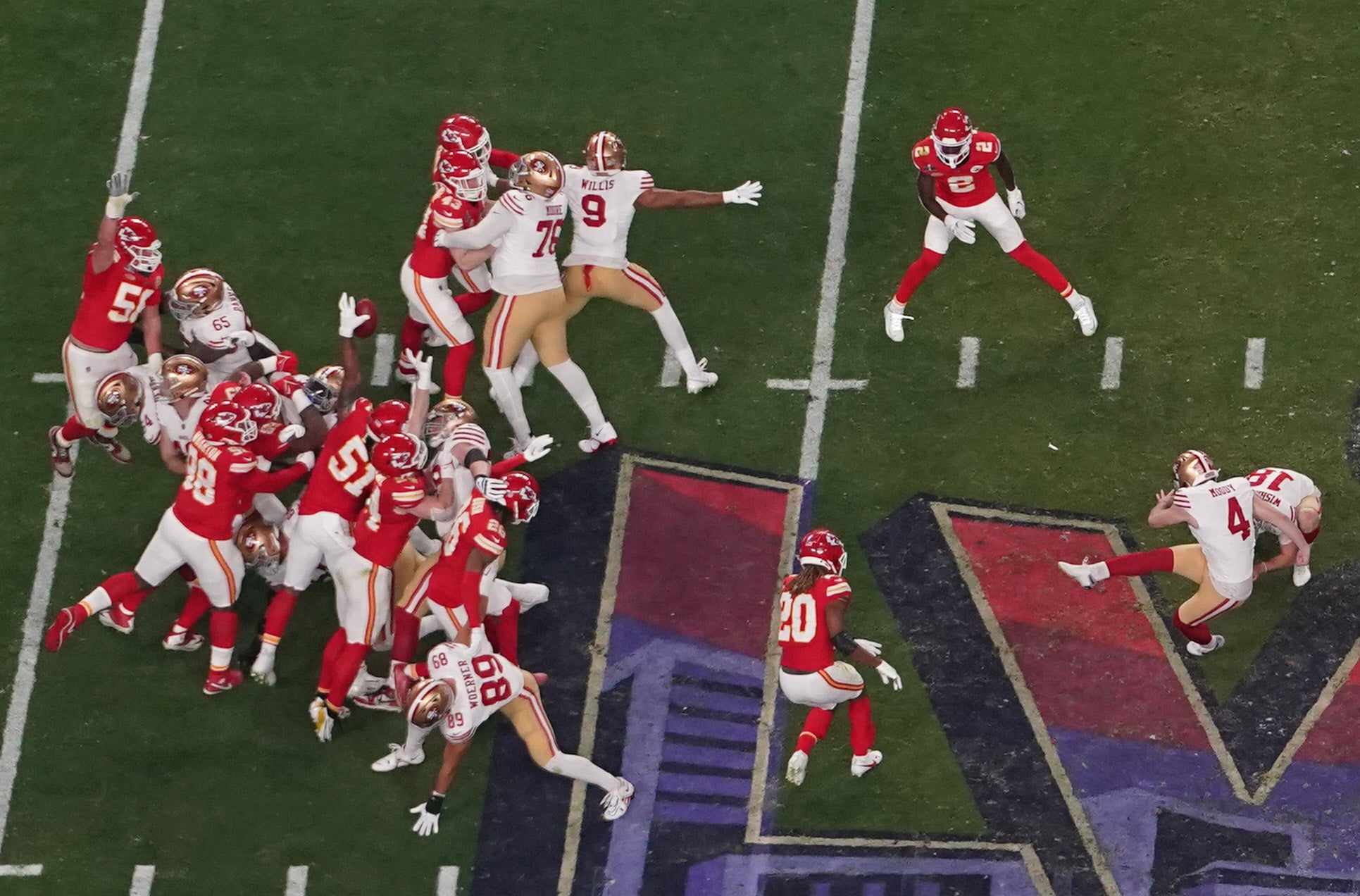 San Francisco 49ers place kicker Jake Moody (4) has his extra point blocked by Kansas City Chiefs defensive end Mike Danna (51) during the fourth quarter in Super Bowl LVIII Allegiant Stadium.