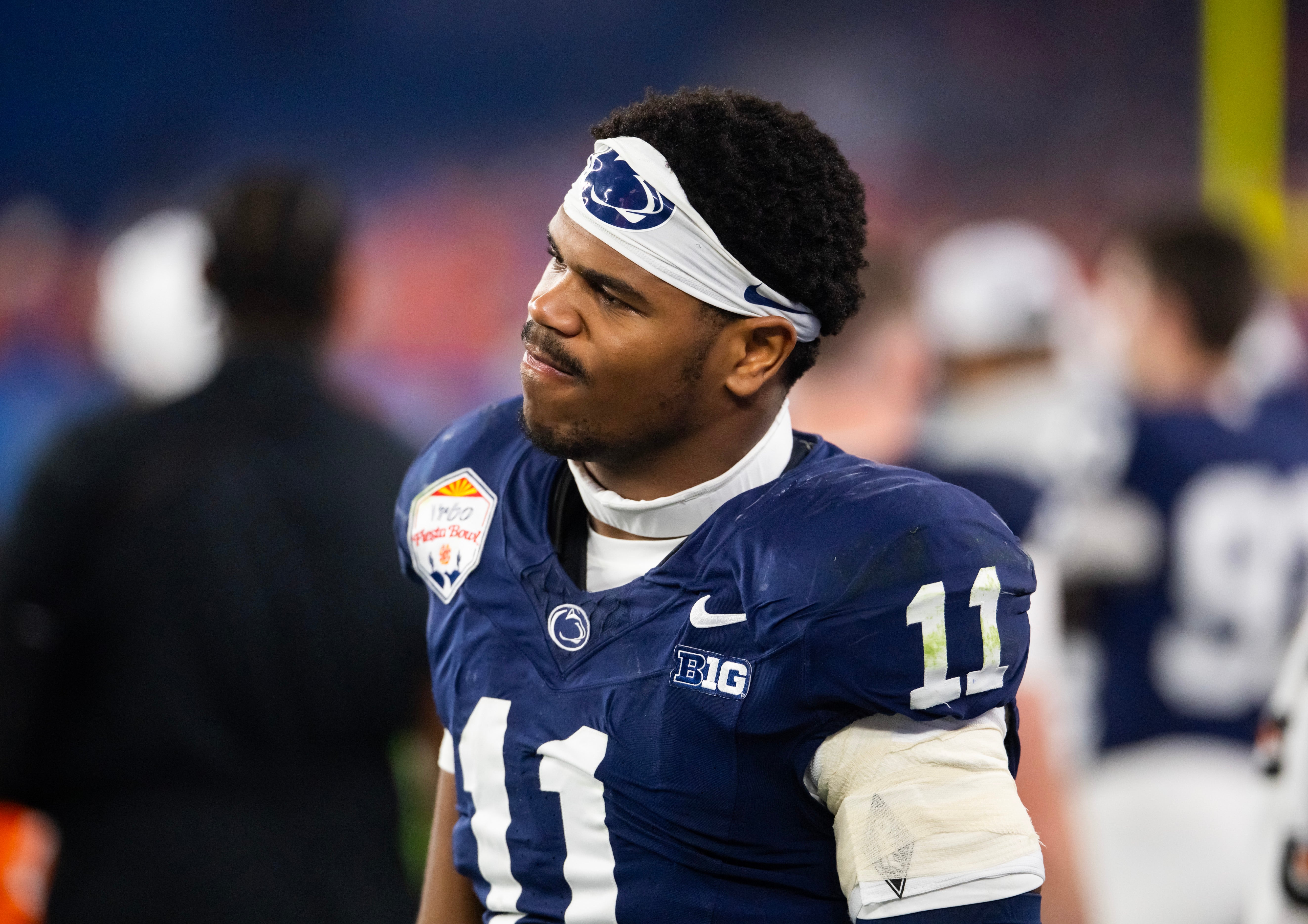 Penn State Nittany Lions defensive end Abdul Carter (11) reacts after suffering an injury against the Boise State Broncos in the Fiesta Bowl at State Farm Stadium. Mark J. Rebilas-Imagn Images