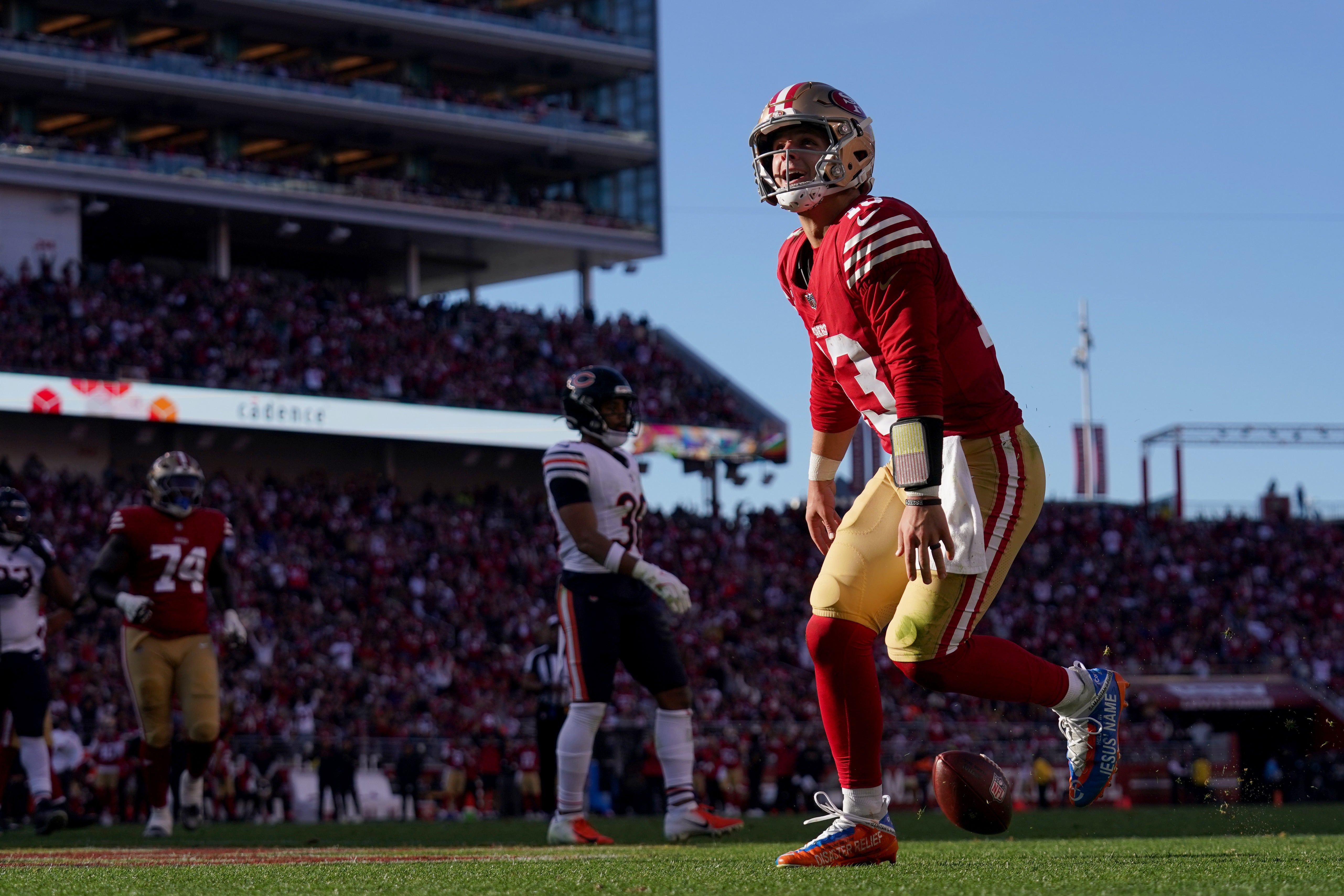 San Francisco 49ers quarterback Brock Purdy (13) reacts after rushing for a touchdown against the Chicago Bears in the second quarter at Levi's Stadium. The play was later called back for offensive holding.