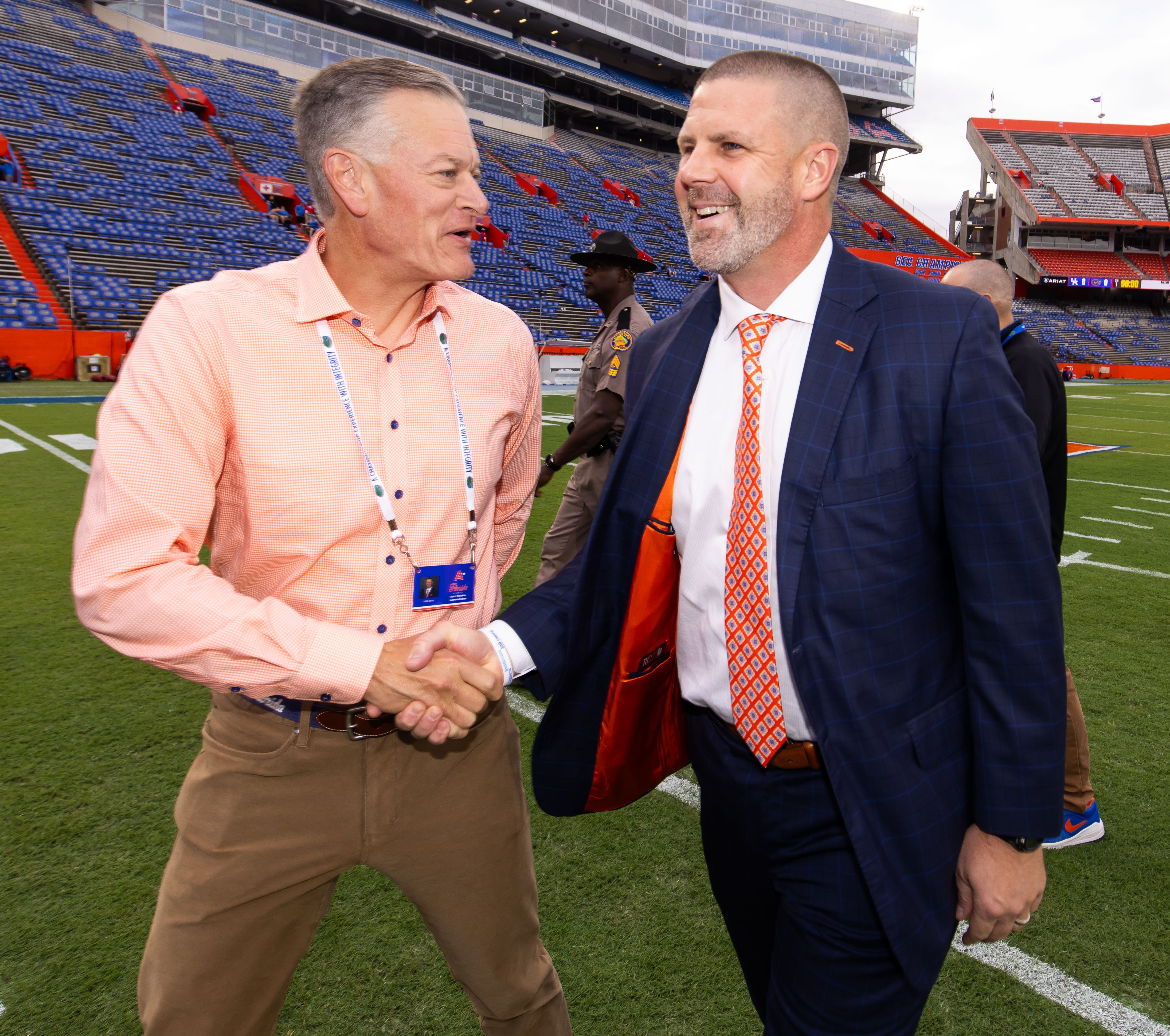 Florida Athletic Director Scott Stricklin shakes hands with Florida Gators head coach Billy Napier during Gator Walk before the game against the Kentucky Wildcats at Ben Hill Griffin Stadium in Gainesville, FL on Saturday, October 19, 2024.
