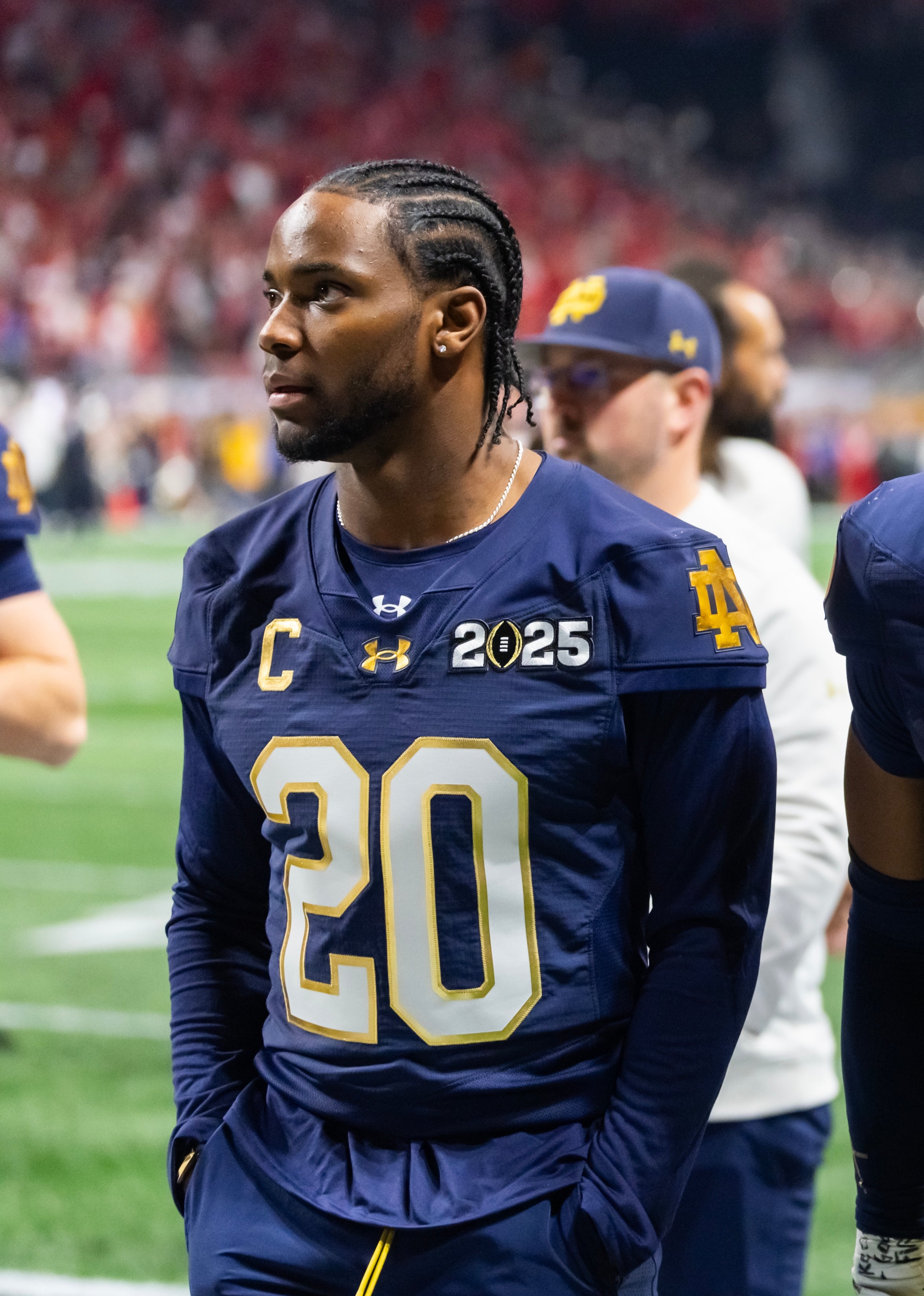 Injured Notre Dame Fighting Irish cornerback Benjamin Morrison (20) against the Ohio State Buckeyes during the CFP National Championship college football game at Mercedes-Benz Stadium.