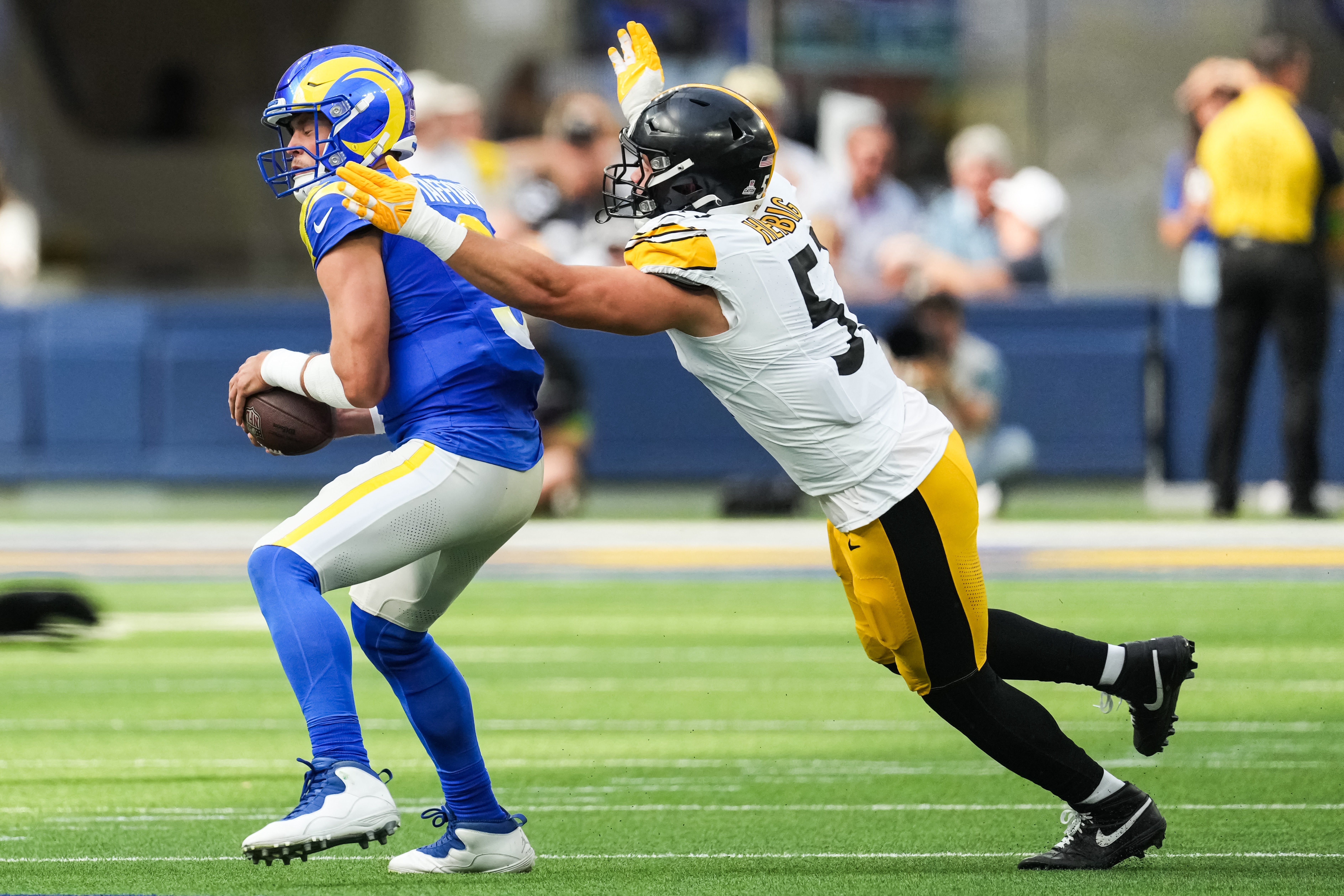 Oct 22, 2023; Inglewood, California, USA; Pittsburgh Steelers linebacker Nick Herbig (51) sacks Los Angeles Rams quarterback Matthew Stafford (9) in the first half at SoFi Stadium.