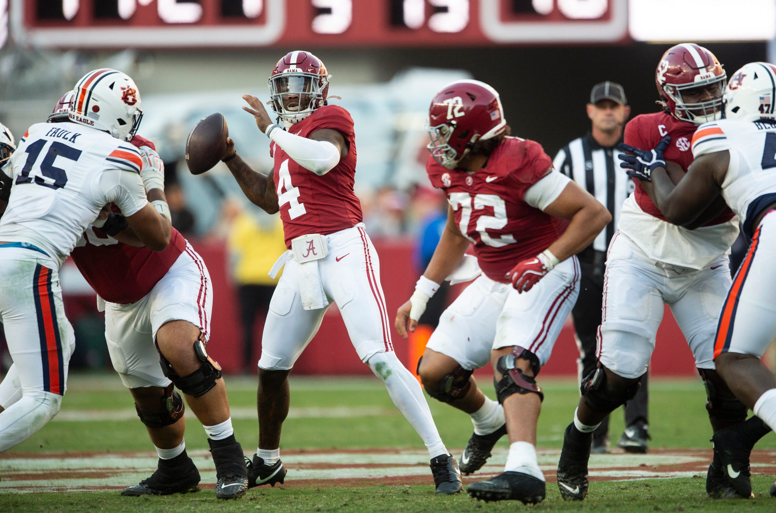 Alabama Crimson Tide quarterback Jalen Milroe (4) throws the ball as Auburn Tigers take on Alabama Crimson Tide at Bryant-Denny Stadium in Tuscaloosa, Ala., on Saturday, Nov. 30, 2024. Alabama Crimson Tide defeated Auburn Tigers 28-14.