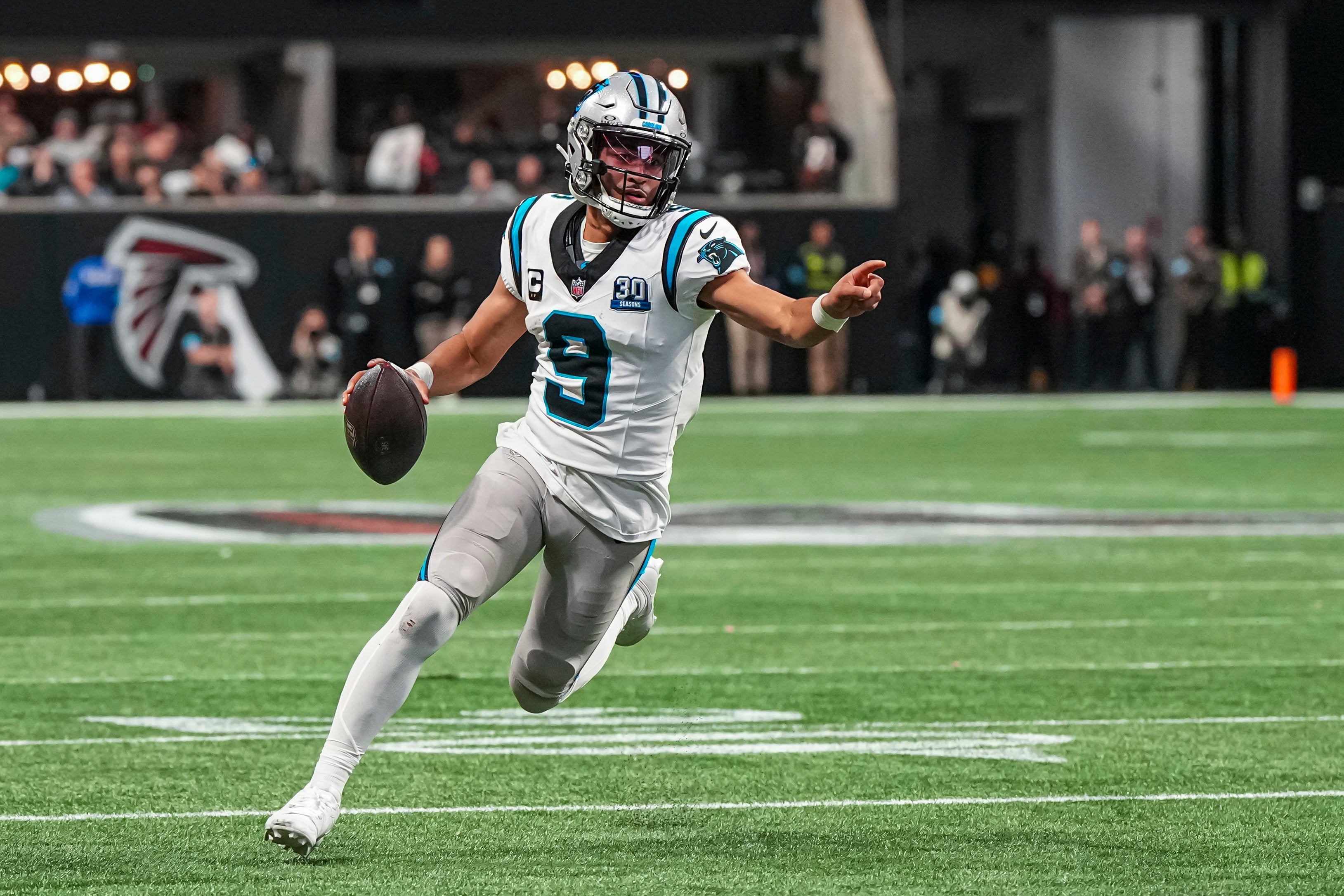 Jan 5, 2025; Atlanta, Georgia, USA; Carolina Panthers quarterback Bryce Young (9) runs for a touchdown against the Atlanta Falcons during the second half at Mercedes-Benz Stadium.