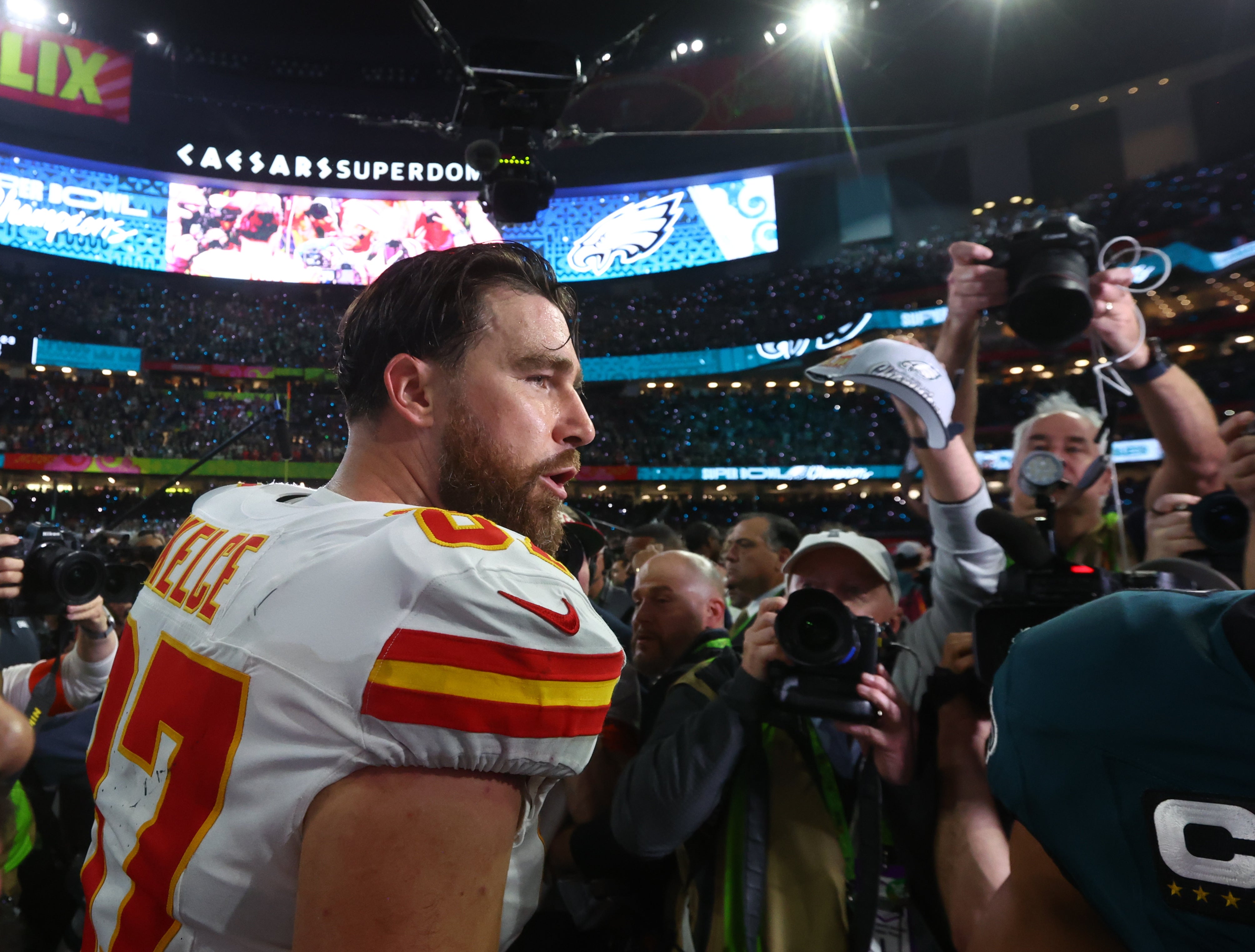 Feb 9, 2025; New Orleans, LA, USA; Kansas City Chiefs tight end Travis Kelce (87) reacts on the field after losing to the Philadelphia Eagles in Super Bowl LIX at Ceasars Superdome.