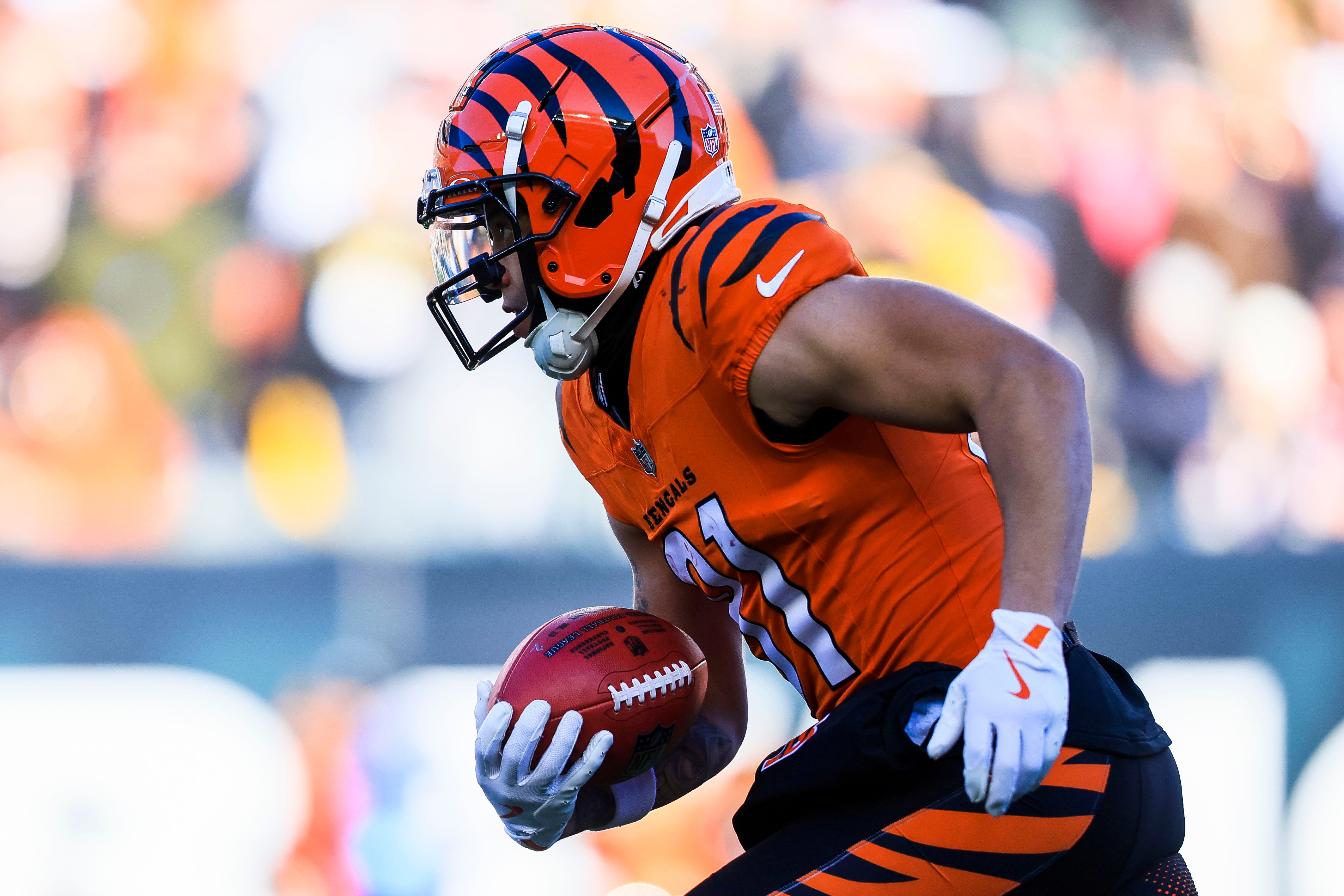 Dec 1, 2024; Cincinnati, Ohio, USA; Cincinnati Bengals wide receiver Jermaine Burton (81) runs with the ball against the Pittsburgh Steelers in the first half at Paycor Stadium.