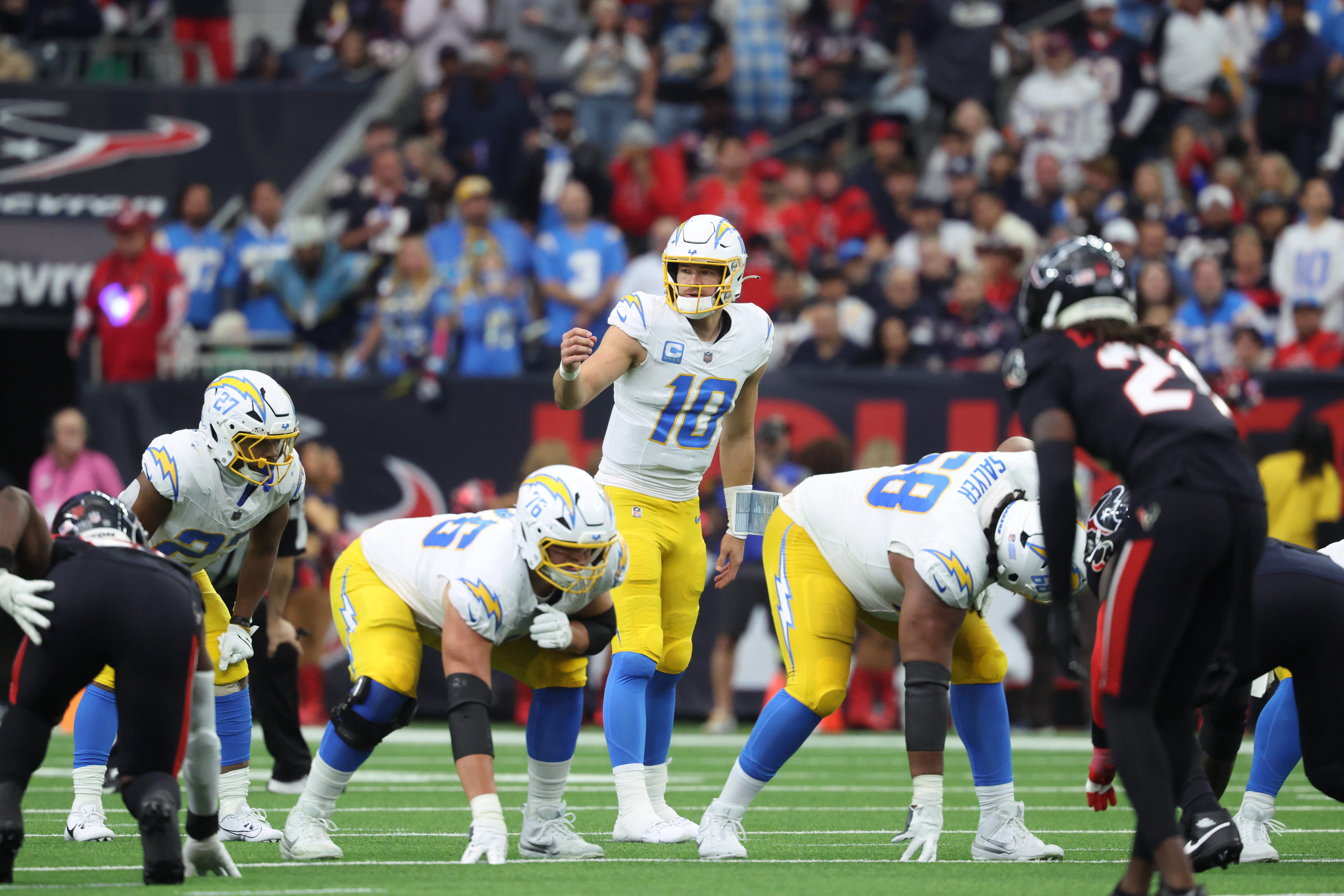 Jan 11, 2025; Houston, Texas, USA; Los Angeles Chargers quarterback Justin Herbert (10) during the second quarter against the Houston Texans in an AFC wild card game at NRG Stadium.