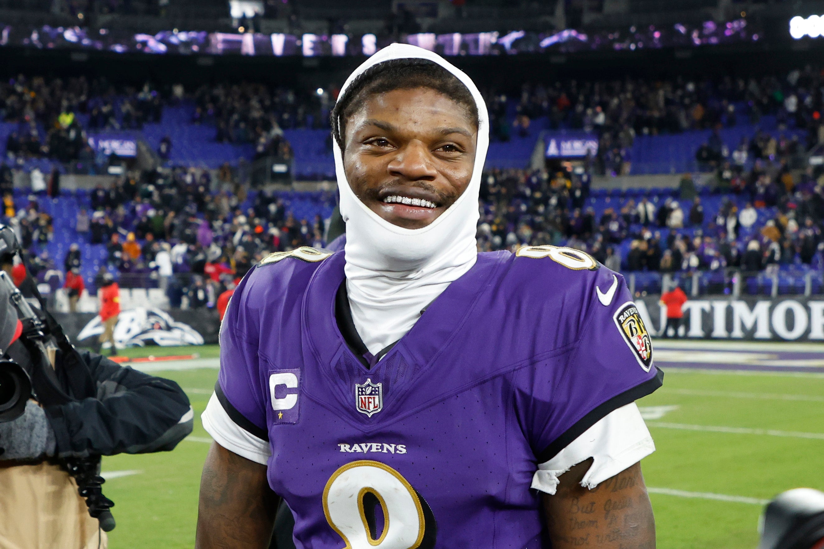 Jan 11, 2025; Baltimore, Maryland, USA; Baltimore Ravens quarterback Lamar Jackson (8) celebrates after defeating the Pittsburgh Steelers in an AFC wild card game at M&T Bank Stadium.