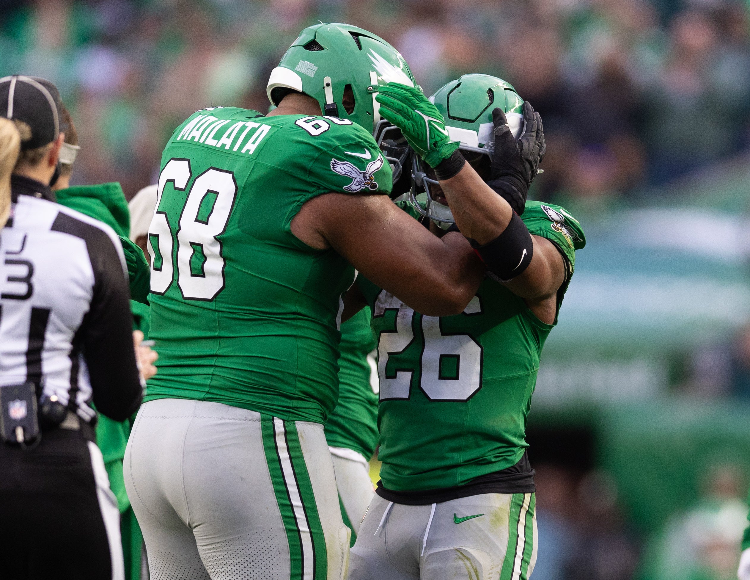 Dec 29, 2024; Philadelphia, Pennsylvania, USA; Philadelphia Eagles running back Saquon Barkley (26) celebrates with offensive tackle Jordan Mailata (68) after rushing for 167 yards in a game against the Dallas Cowboys at Lincoln Financial Field.