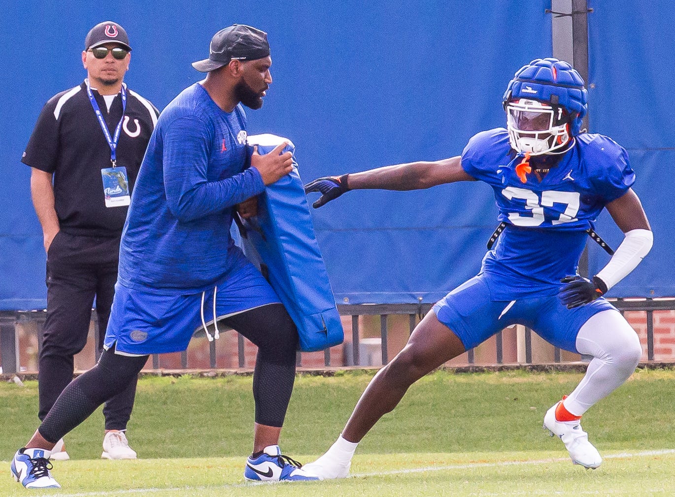 New Florida secondary coach Will Harris runs a drill with one of his defensive backs during the Florida Gators as they held their final open Spring football practice before the Orange and Blue Game at Sanders Practice Fields in Gainesville, FL on Tuesday, April 9, 2024.