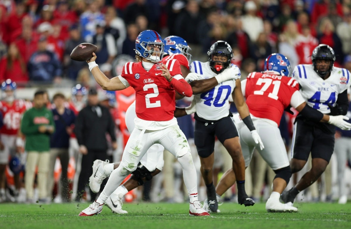 Mississippi Rebels quarterback Jaxson Dart (2) drops back to pass against the Duke Blue Devils in the first quarter during the Gator Bowl at EverBank Stadium.  