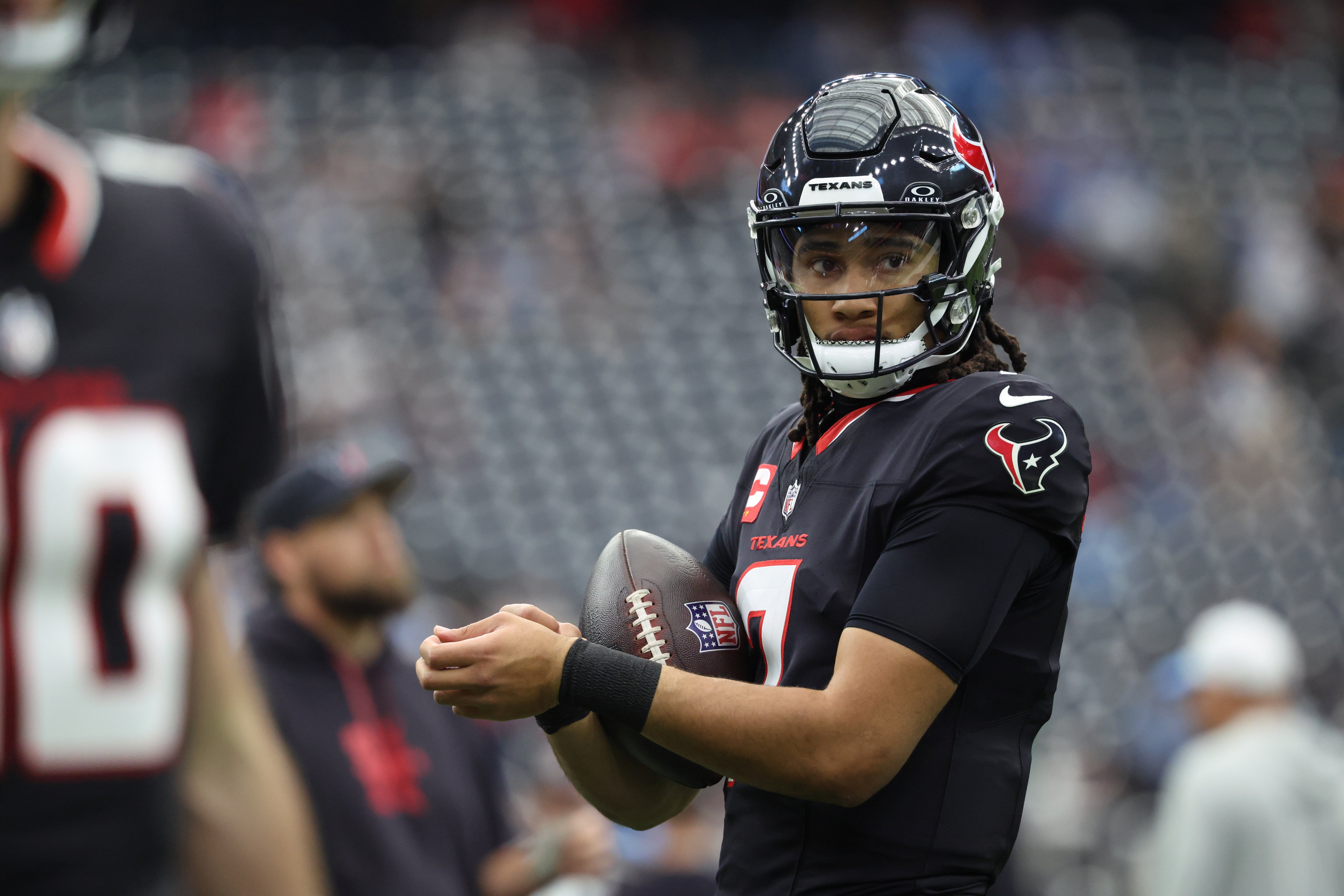 Jan 11, 2025; Houston, Texas, USA; Houston Texans quarterback C.J. Stroud (7) warms up prior to the game against the Los Angeles Chargers in an AFC wild card game at NRG Stadium.