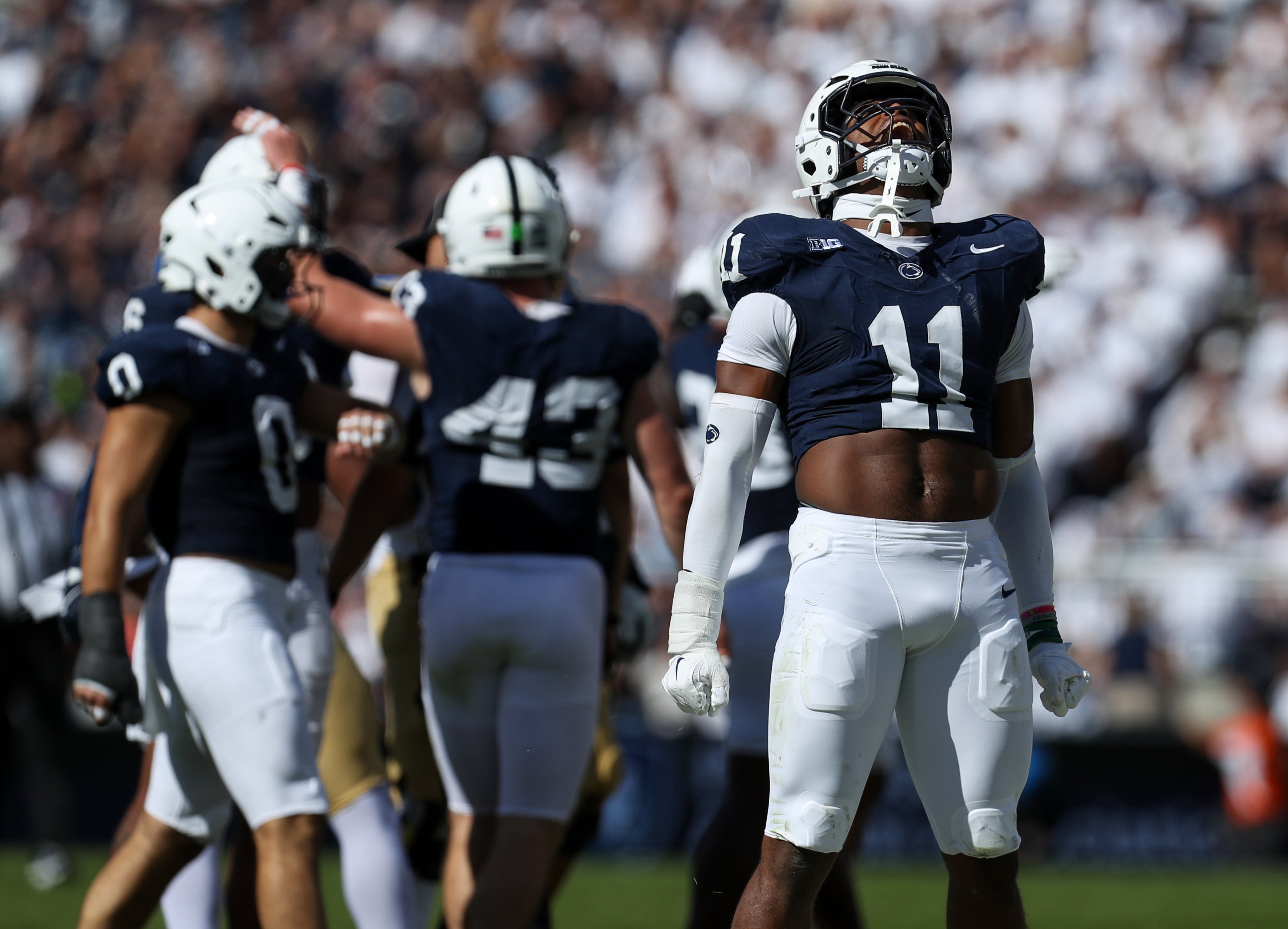 Penn State Nittany Lions defensive end Abdul Carter (11) reacts after tackling UCLA Bruins running back Jalen Berger (0) during the third quarter at Beaver Stadium.