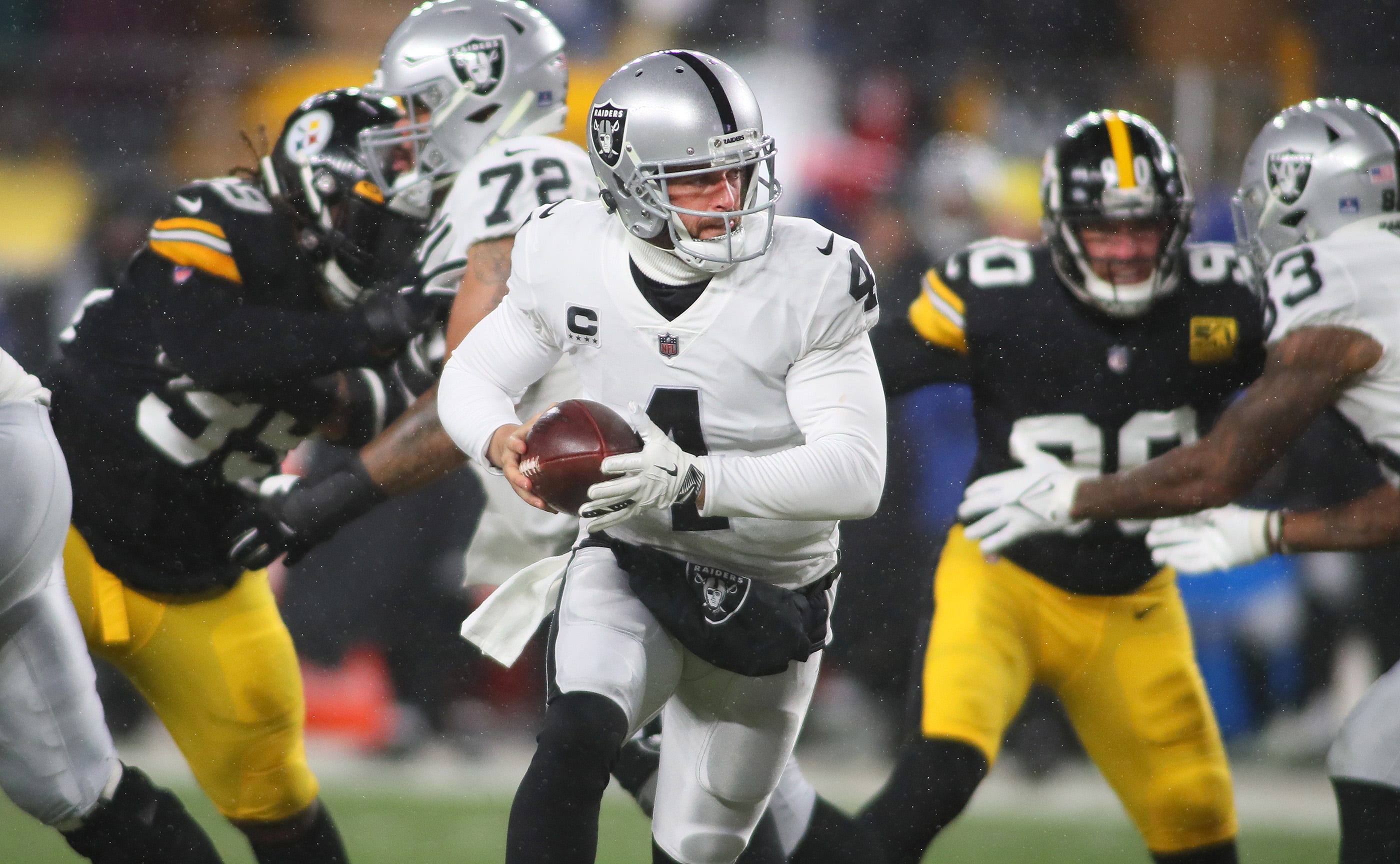 Las Vegas Raiders Derek Carr (4) prepares to hand the ball off during the first half against the Pittsburgh Steelers at Acrisure Stadium in Pittsburgh, PA on December 24, 2022. Pittsburgh Steelers Vs Las Vegas Raiders Week 16