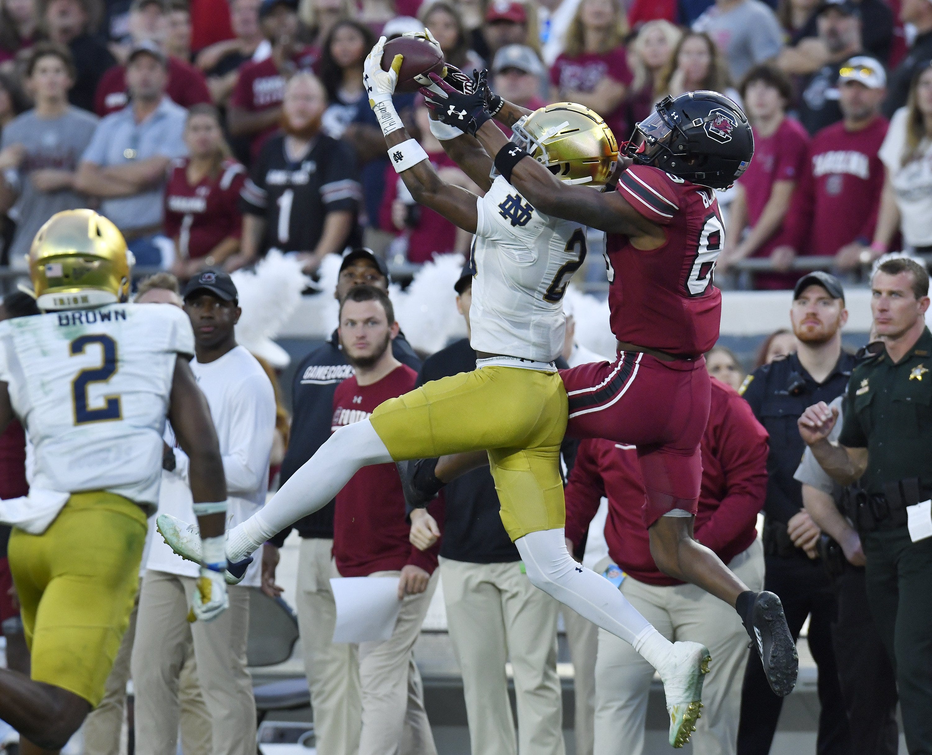 Notre Dame Fighting Irish cornerback Benjamin Morrison (20) intercepts a late second quarter pass intended for South Carolina Gamecocks wide receiver O'Mega Blake (89). The University of Notre Dame Fighting Irish took on the University of South Carolina Gamecocks in the TaxSlayer Gator Bowl game in Jacksonville, Florida's TIAA Bank Field Friday, December 30, 2022. The first half ended with South Carolina holding a 24 to 17 lead.