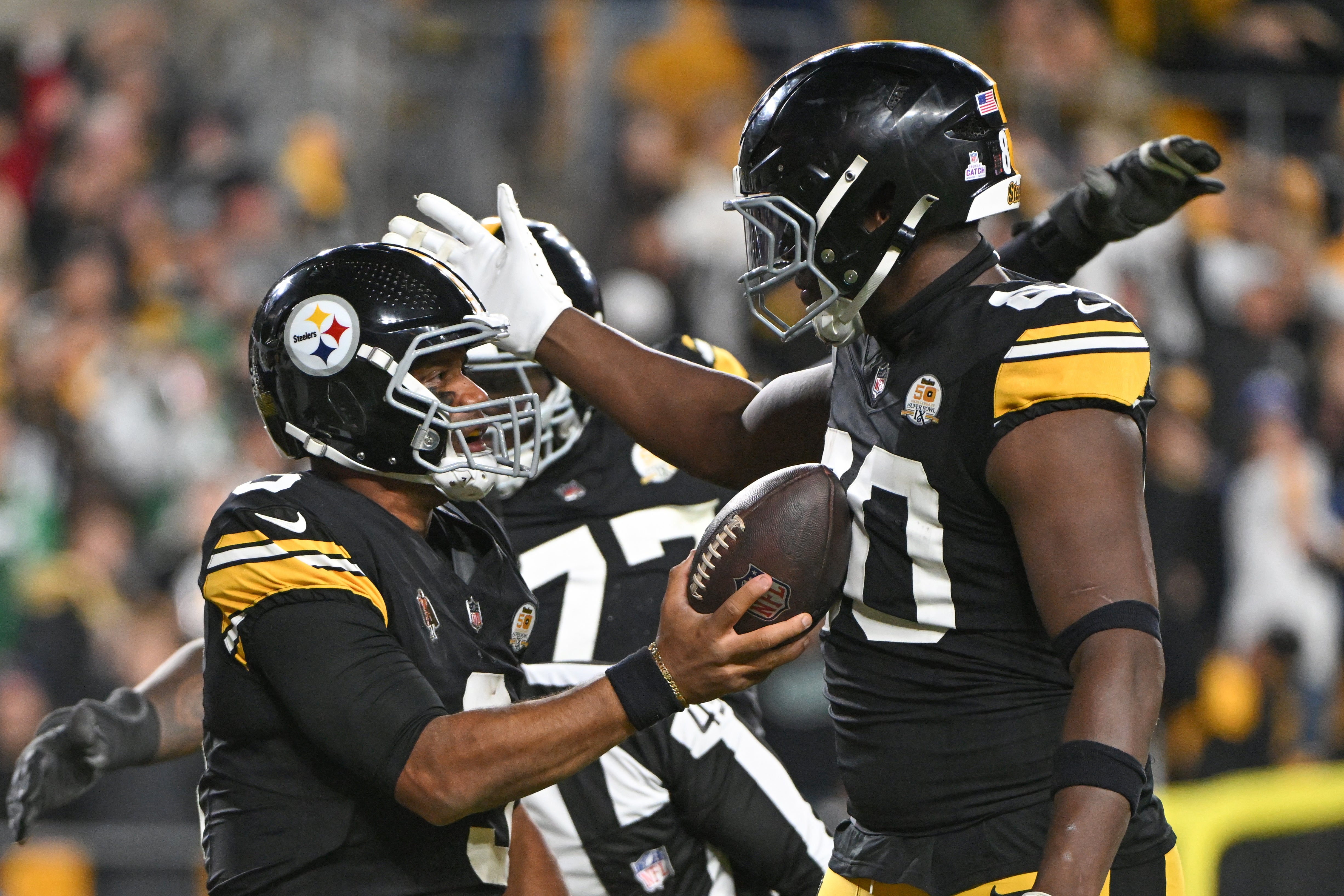 Oct 20, 2024; Pittsburgh, Pennsylvania, USA; Pittsburgh Steelers quarterback Russell Wilson (3) celebrates a touchdown with tight end Darnell Washington (80) against the New York Jets during the third quarter at Acrisure Stadium.