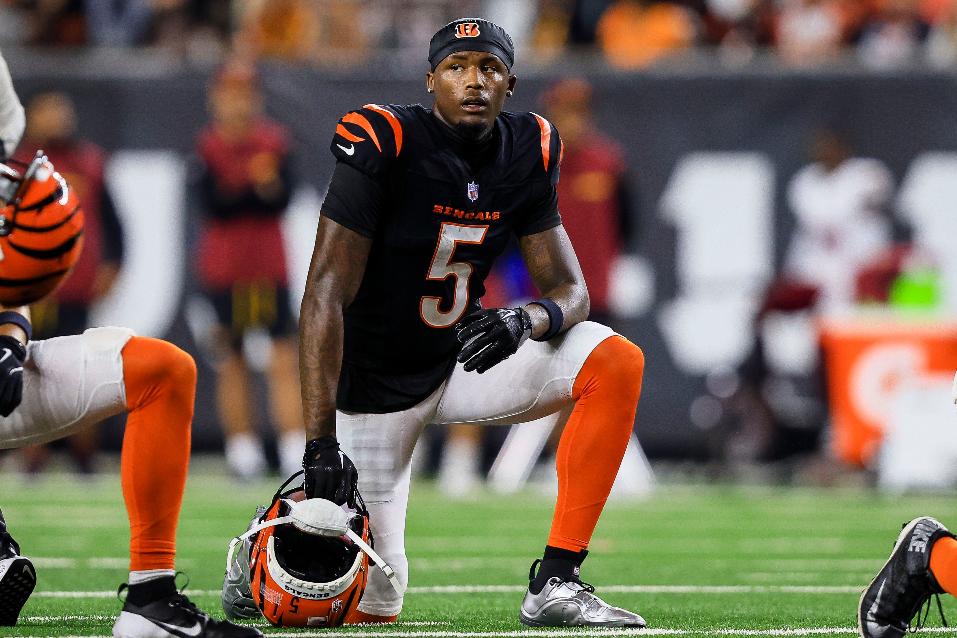 Sep 23, 2024; Cincinnati, Ohio, USA; Cincinnati Bengals wide receiver Tee Higgins (5) kneels during a stop in play in the first half against the Washington Commanders at Paycor Stadium.