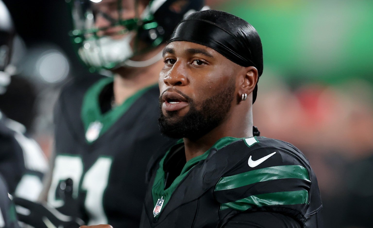 Oct 31, 2024; East Rutherford, New Jersey, USA; New York Jets defensive end Haason Reddick (7) on the sidelines during the first quarter against the Houston Texans at MetLife Stadium.