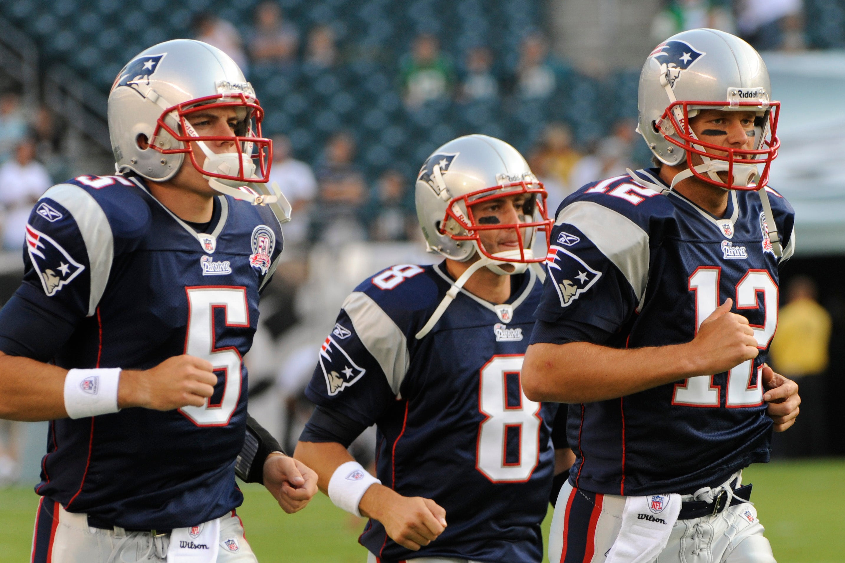 Aug 13, 2009; Philadelphia, PA, USA; New England Patriots quarterback Tom Brady (12) leads fellow quarterbacks Kevin O'Connell (5) and Brian Hoyer (8) onto the field prior to playing the Philadelphia Eagles in a preseason game at Lincoln Financial Field.