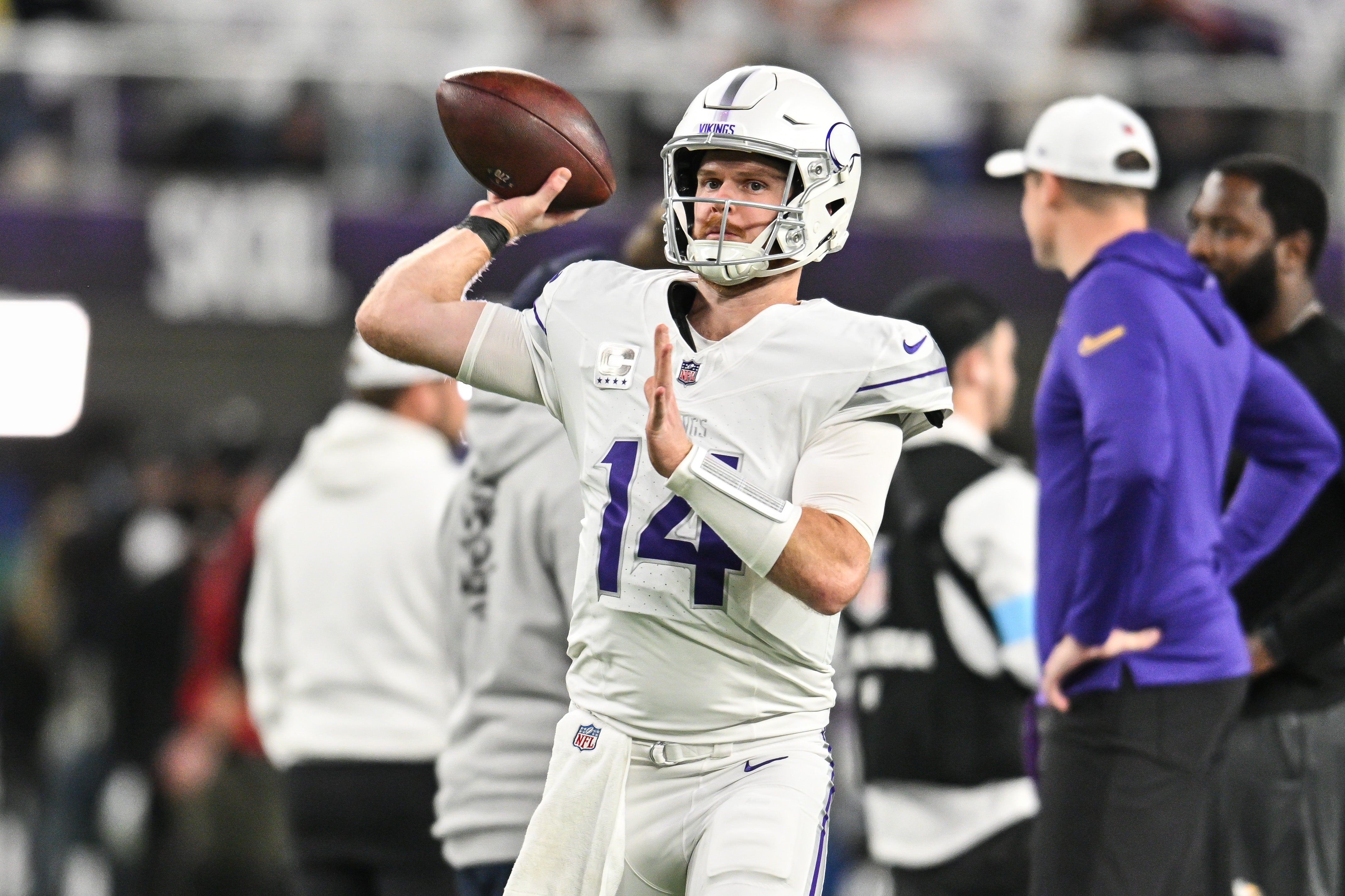 Dec 16, 2024; Minneapolis, Minnesota, USA; Minnesota Vikings quarterback Sam Darnold (14) warms up before the game against the Chicago Bears at U.S. Bank Stadium.