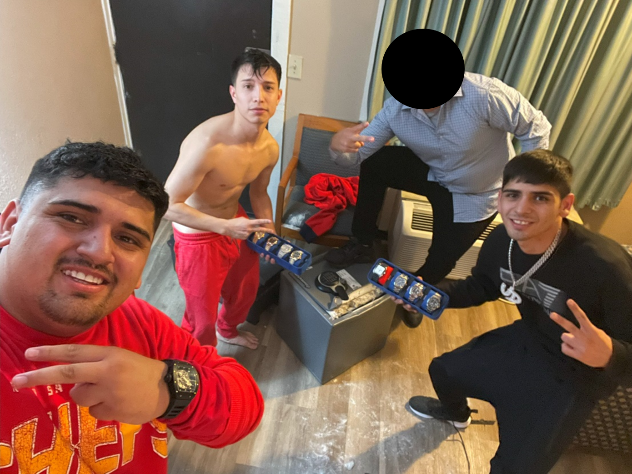 Pablo Zuniga Cartes, Ignacio Zuniga Cartes, Bastian Jimenez Freraut, and a fourth individual posing with the stolen safe and jewelry taken shortly after the theft. Nov. 2, 2024.