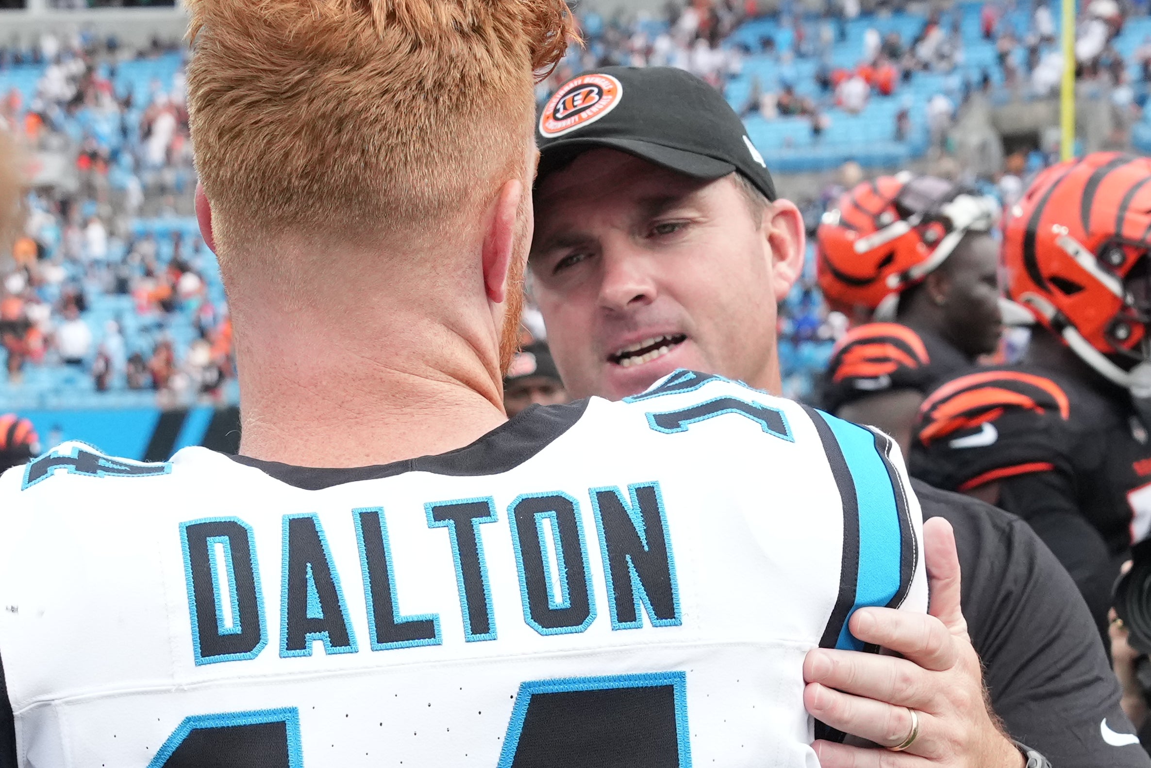 Sep 29, 2024; Charlotte, North Carolina, USA; Cincinnati Bengals head coach Zac Taylor with Carolina Panthers quarterback Andy Dalton (14) after the game at Bank of America Stadium.