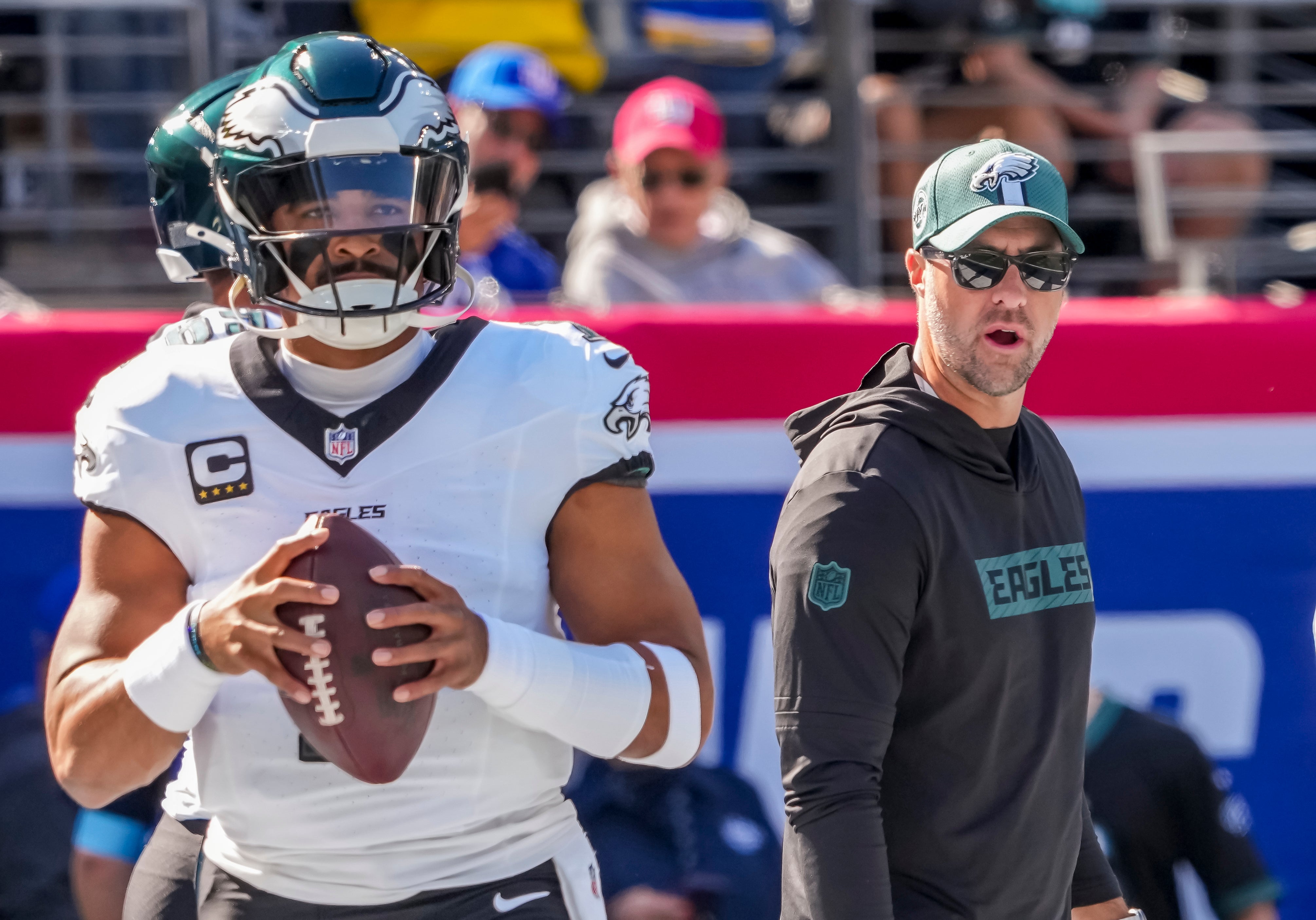 Philadelphia Eagles quarterback Jalen Hurts (1) and head coach Nick Sirianni pregame against the New York Giants at MetLife Stadium.