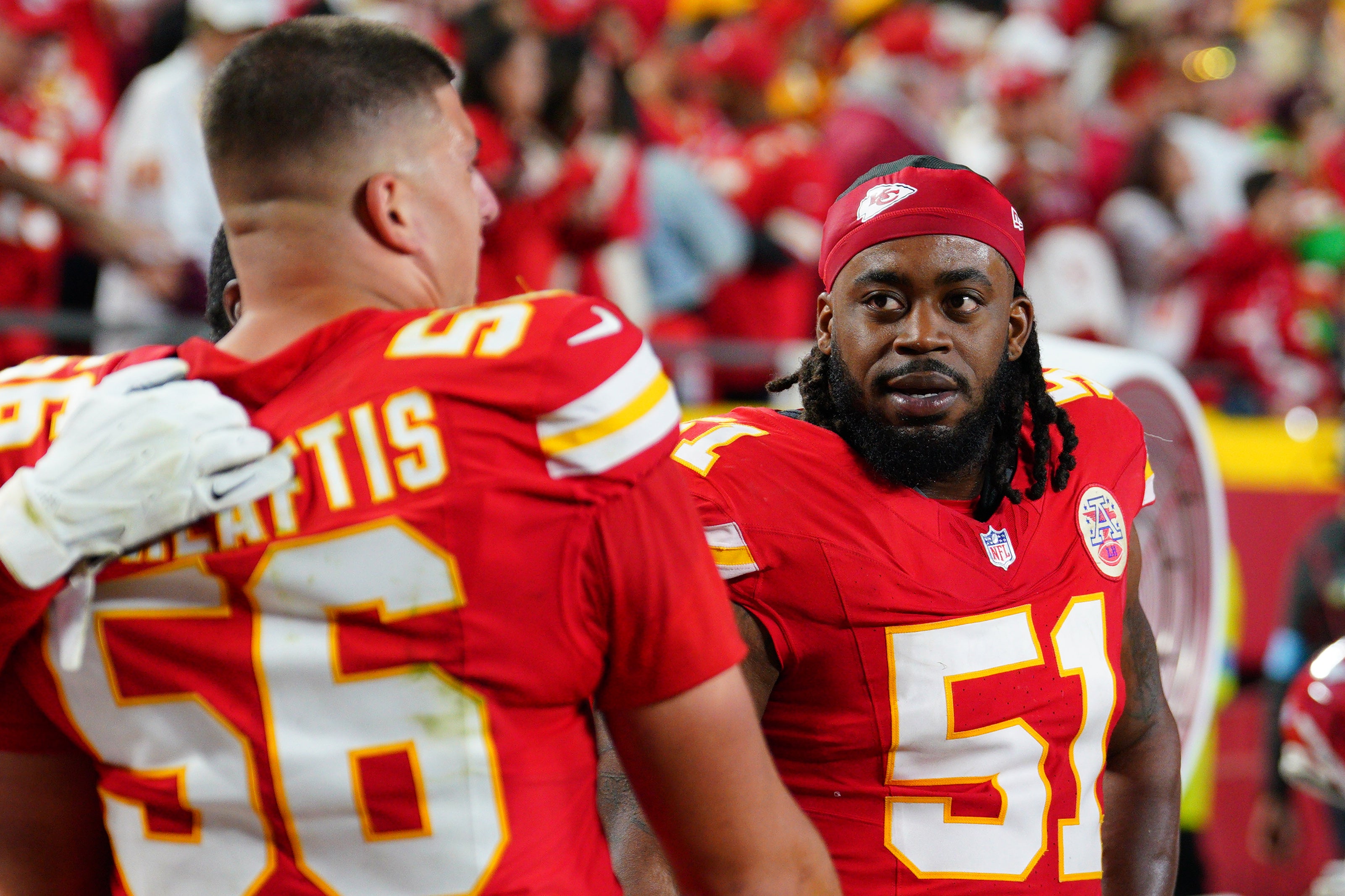 Chiefs DE Mike Danna (51) talks with DE George Karlaftis (56)