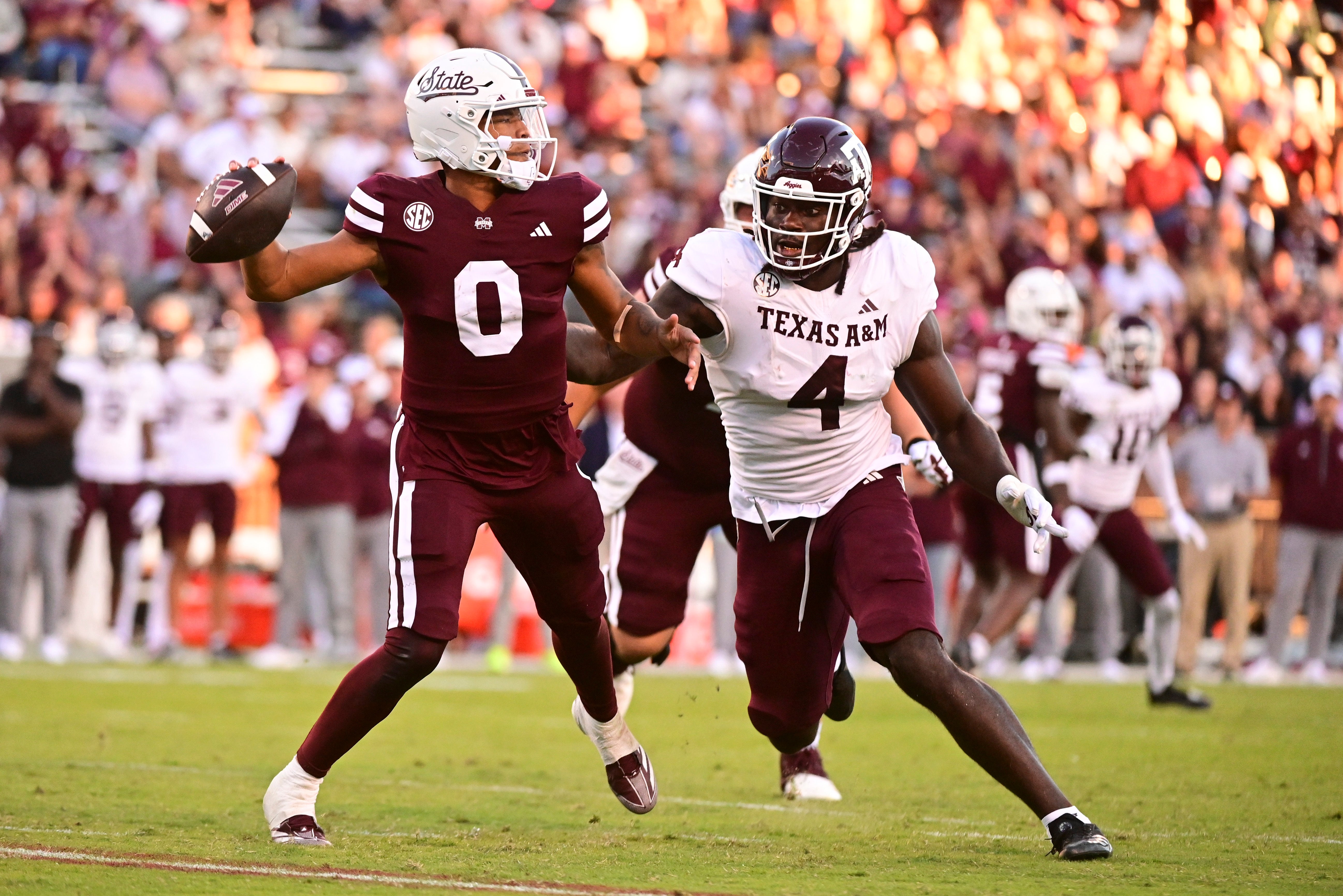 Mississippi State Bulldogs quarterback Michael Van Buren Jr. (0) drops back to pass against Texas A&M Aggies defensive lineman Shemar Stewart (4) during the third quarter at Davis Wade Stadium at Scott Field.