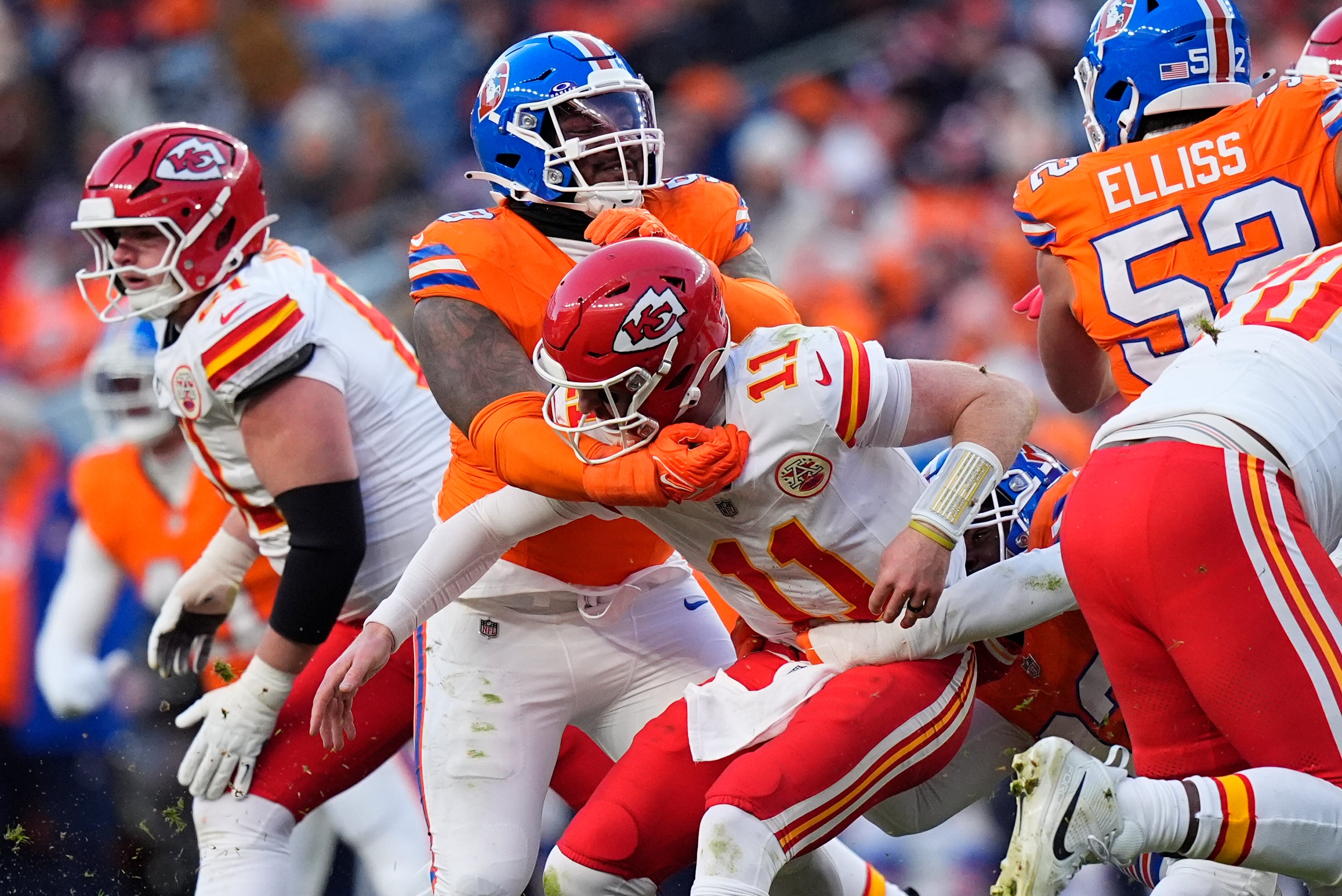 Broncos defensive end John Franklin-Myers (98) hits Chiefs quarterback Carson Wentz (11)