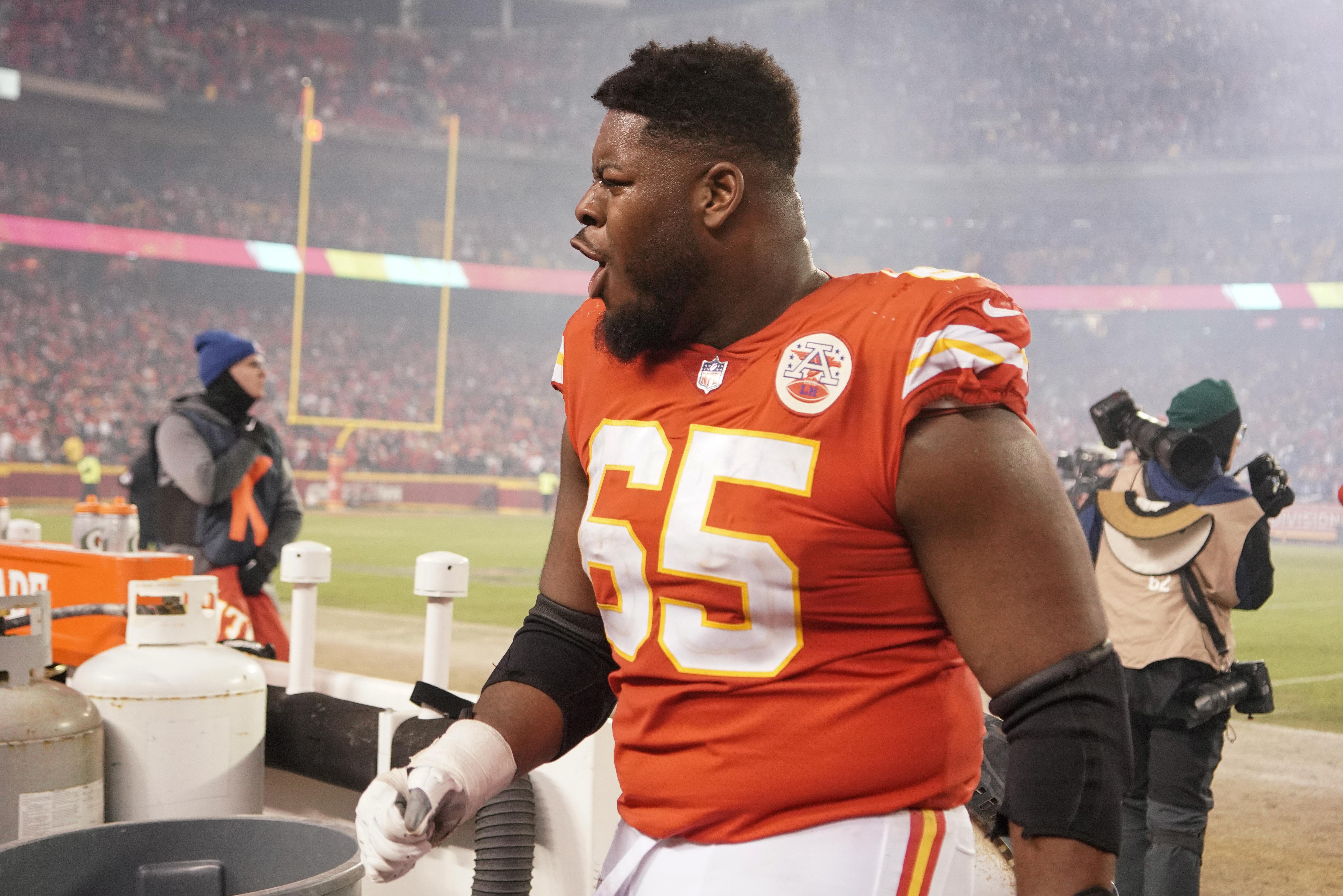 Jan 23, 2022; Kansas City, Missouri, USA; Kansas City Chiefs guard Trey Smith (65) celebrates while leaving the field after the win over the Buffalo Bills during an AFC Divisional playoff football game at GEHA Field at Arrowhead Stadium.