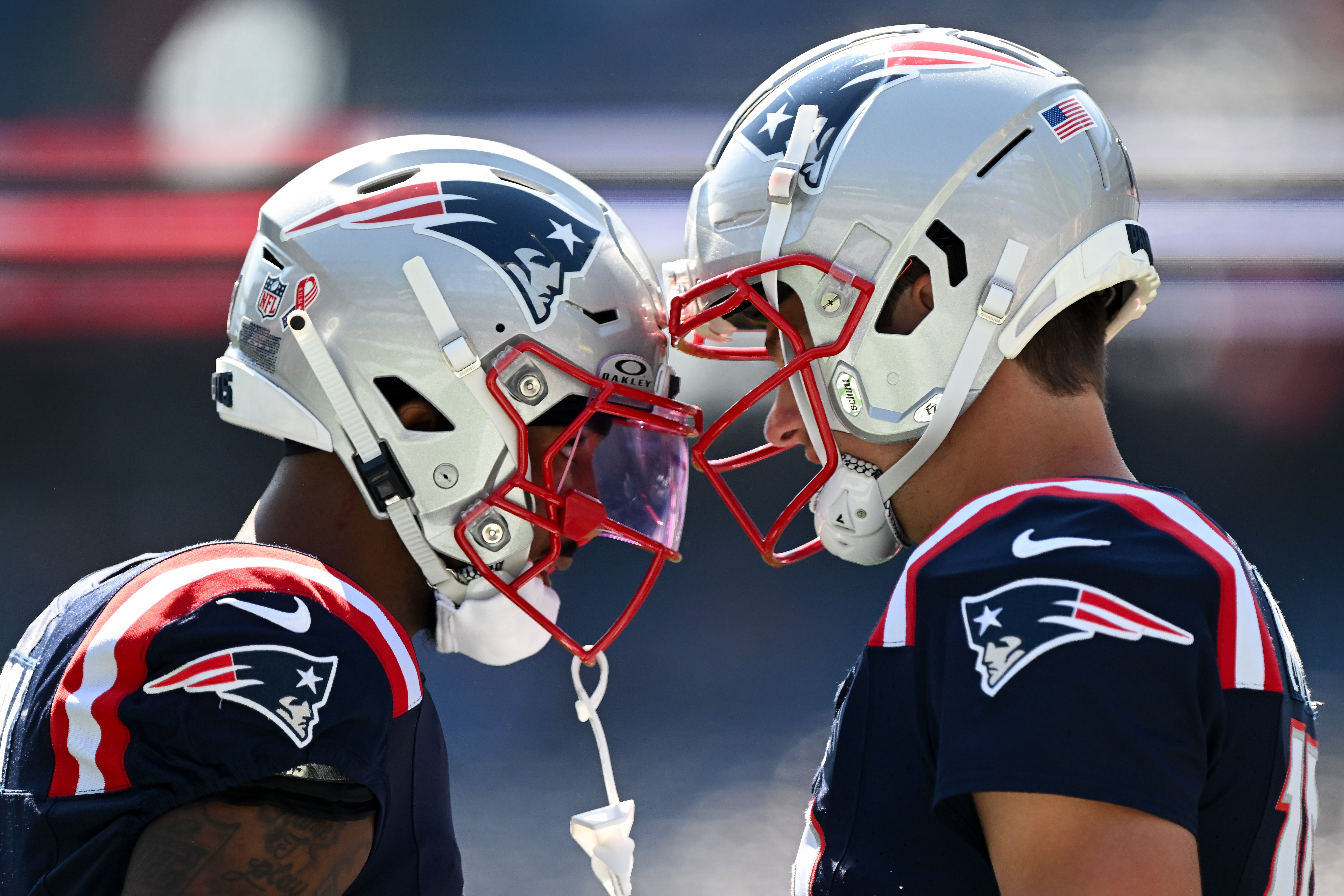 Sep 15, 2024; Foxborough, Massachusetts, USA; New England Patriots quarterback Drake Maye (10) and wide receiver Ja'Lynn Polk (1) talk before a game against the Seattle Seahawks at Gillette Stadium.