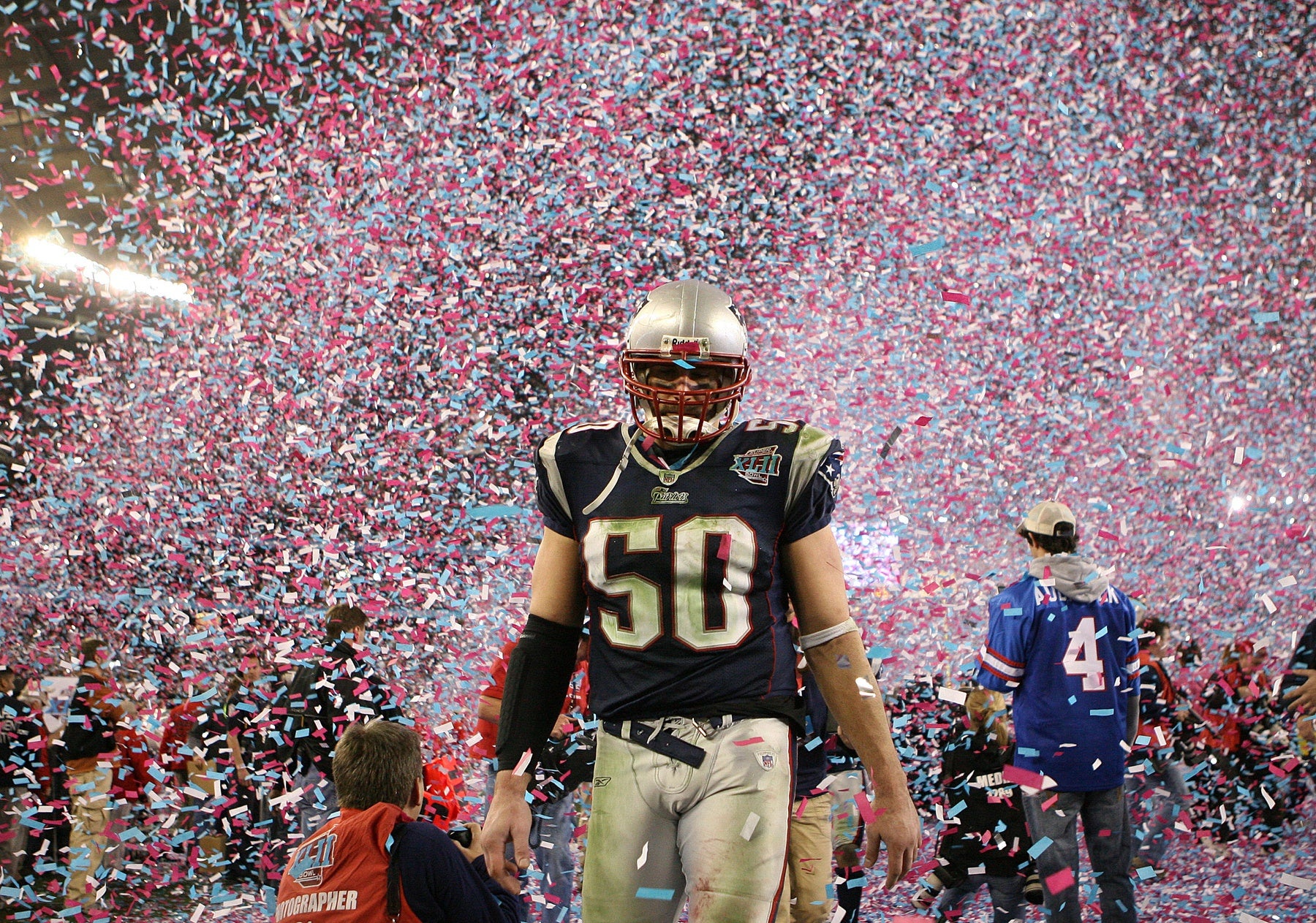 2008: Patriots linebacker Mike Vrabel walks off the field as confetti flies through the air after the New York Giants defeated the New England Patriots 17-14 in Super Bowl XLII.