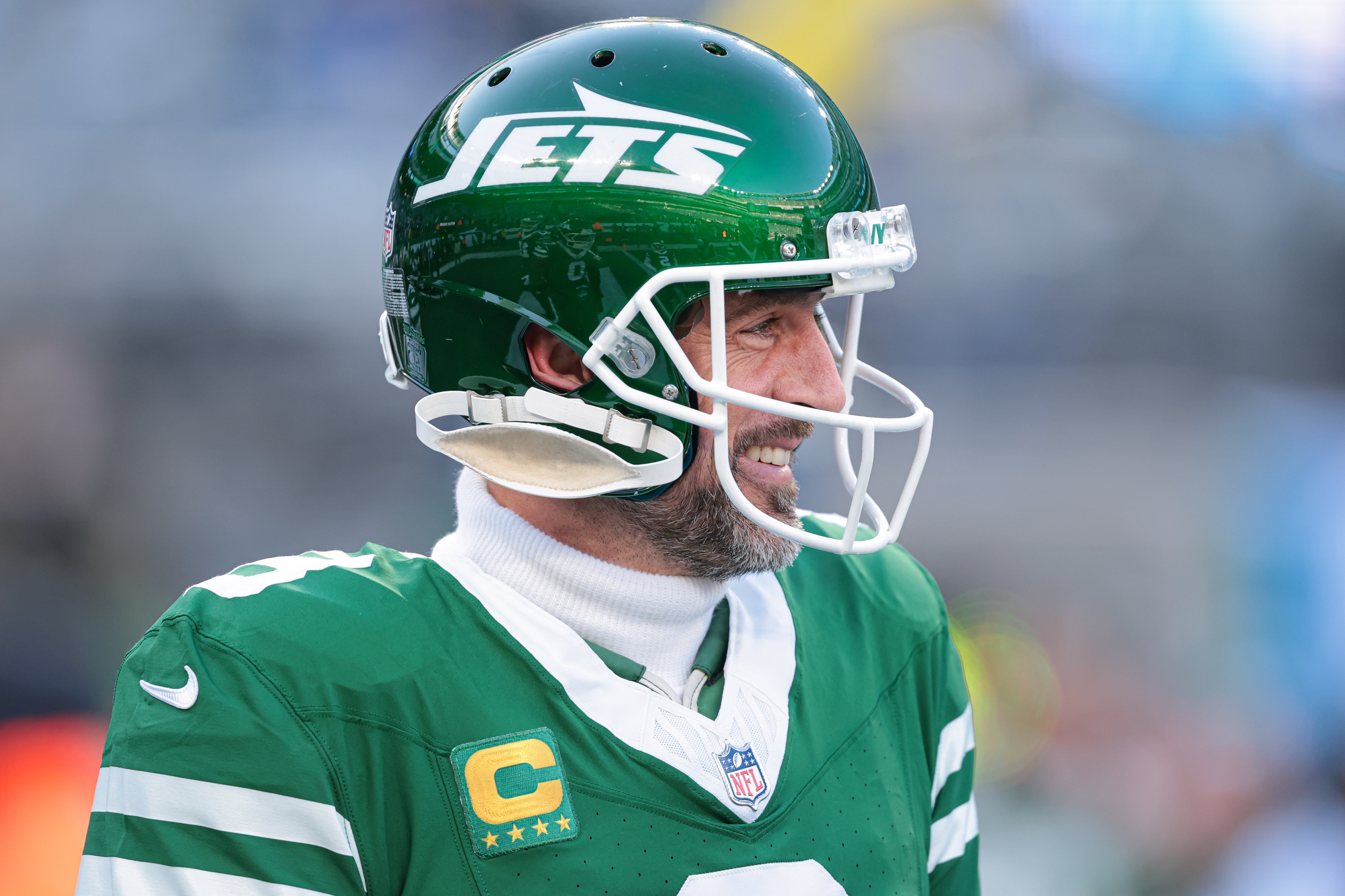 New York Jets quarterback Aaron Rodgers (8) looks on before the game against the Los Angeles Rams at MetLife Stadium.