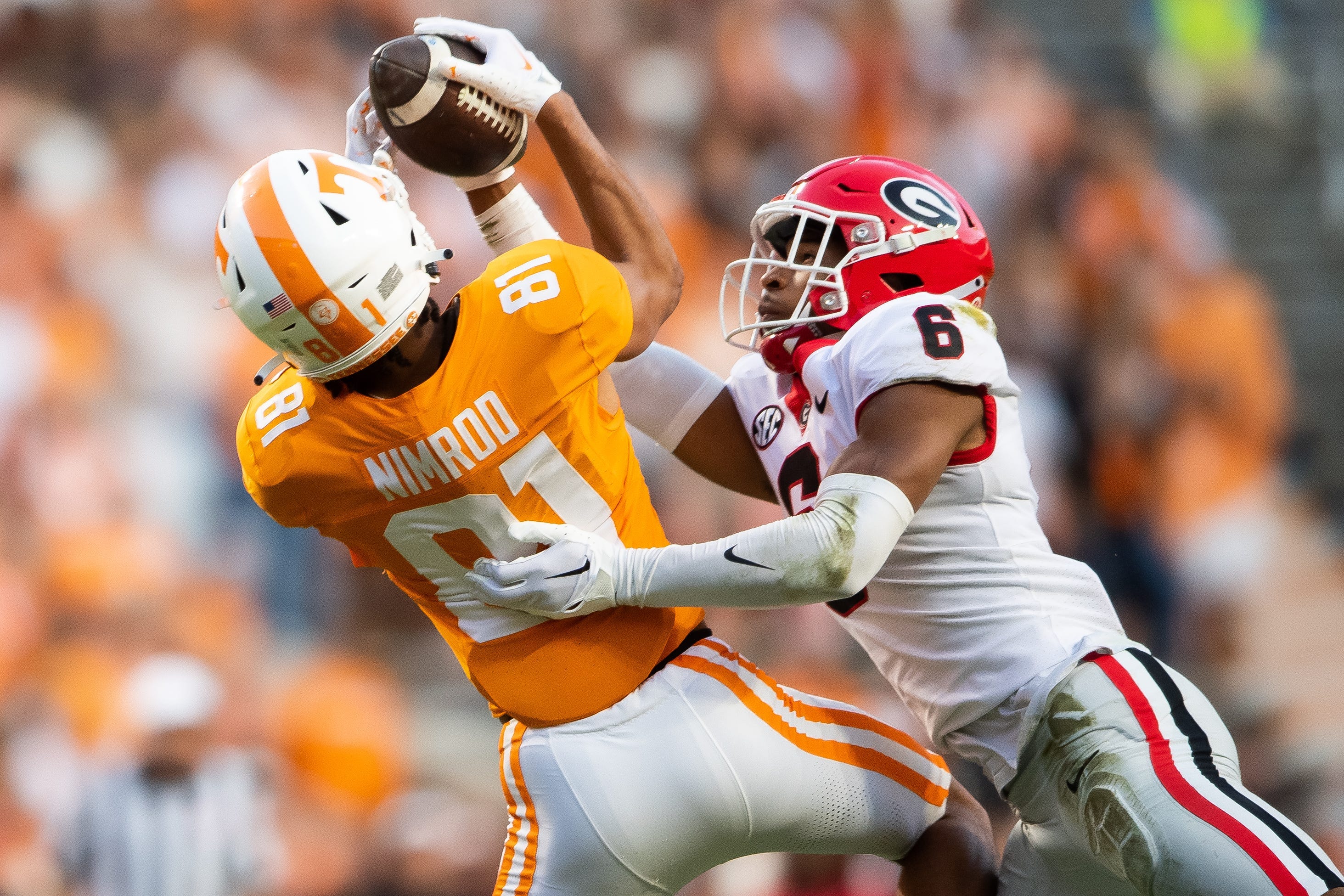 Tennessee wide receiver Chas Nimrod (81) catches a pass while defended by Georgia defensive back Daylen Everette (6) during a football game between Tennessee and Georgia at Neyland Stadium in Knoxville.